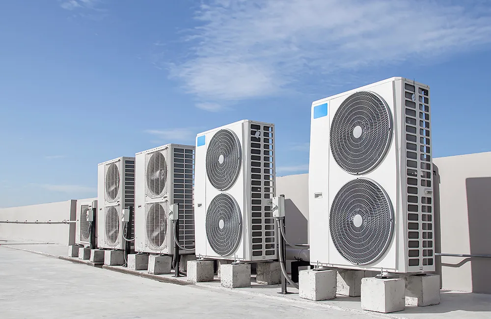 Heat pumps on roof with a blue sky
