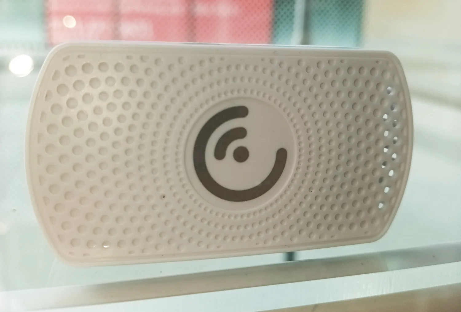 Small white plastic console resting on a surface