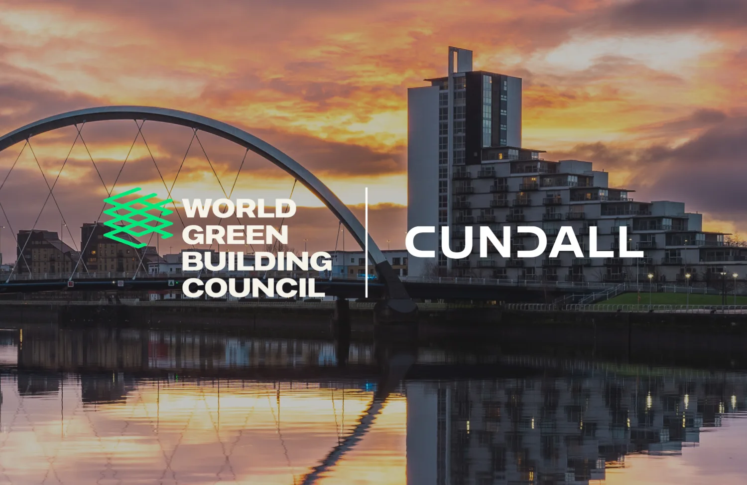 Modern bridge over a calm river at sunset with cityscape in the background. Overlaid logos read 'World Green Building Council' and 'Cundall'.