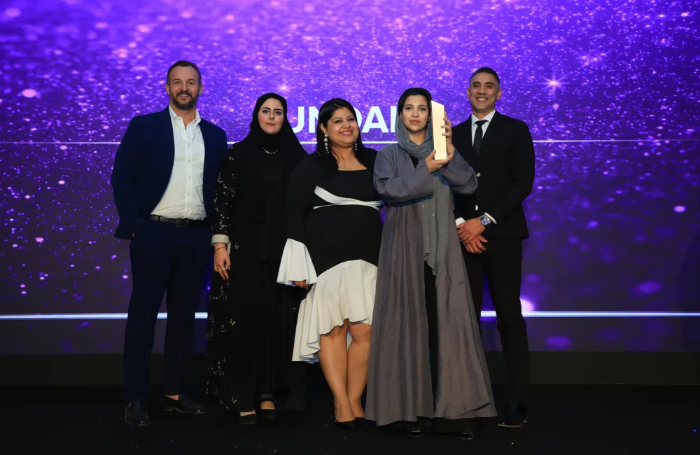 Cundall employees holding the Consultancy of the Year trophy at the CW KSA Awards 2025 during the award ceremony.