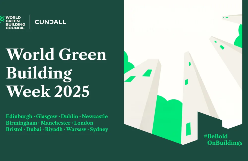 Promotional image for World Green Building Week 2025. Left side shows logos and event text with a list of cities. Right side features illustrated tall buildings with green accents on a white background. Hashtag #BeBoldOnBuildings at bottom right.