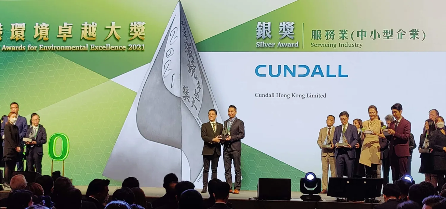 Joe Tang receiving the award on stage.