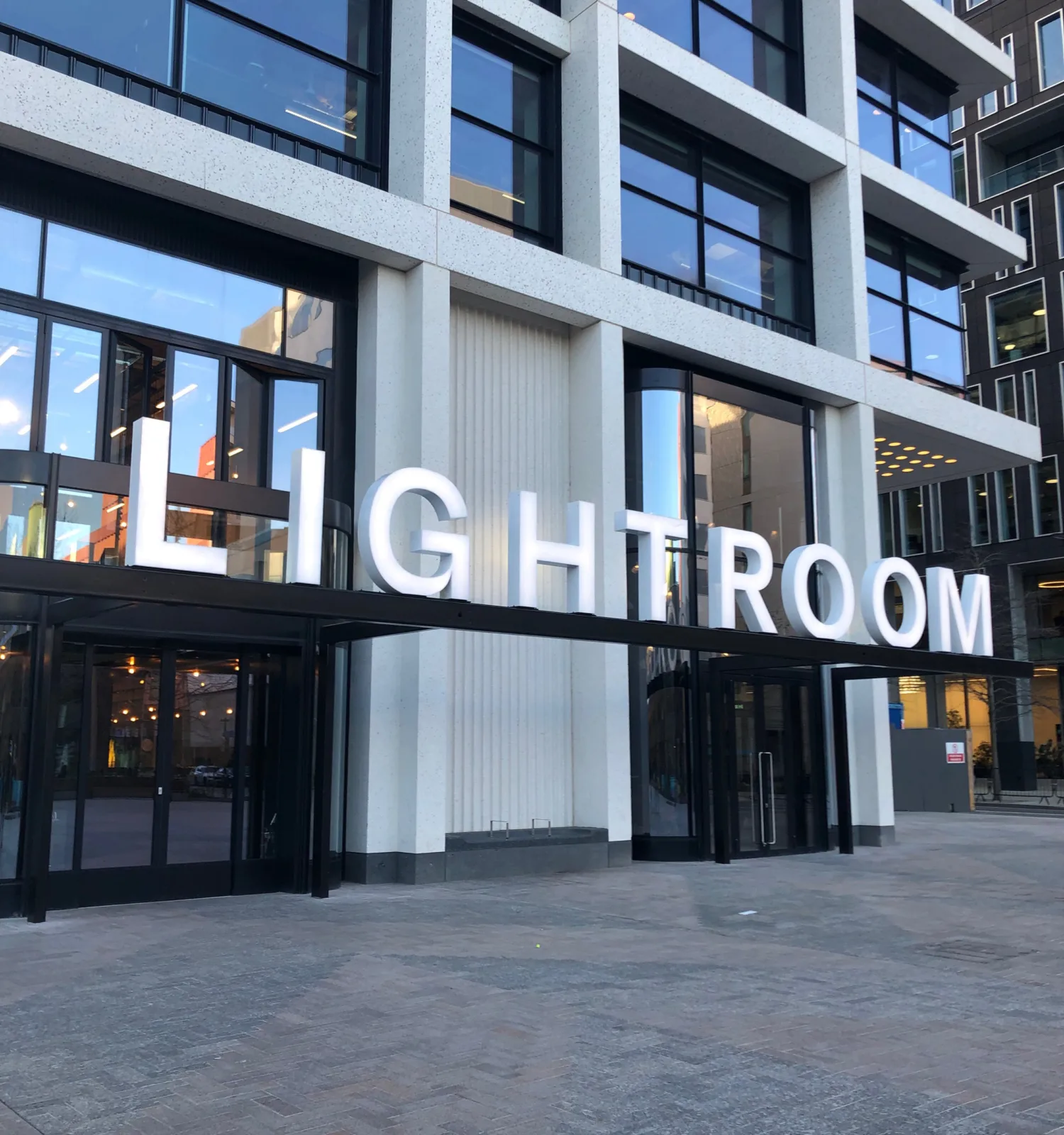 The Lightroom building signage at dusk with subtle lighting