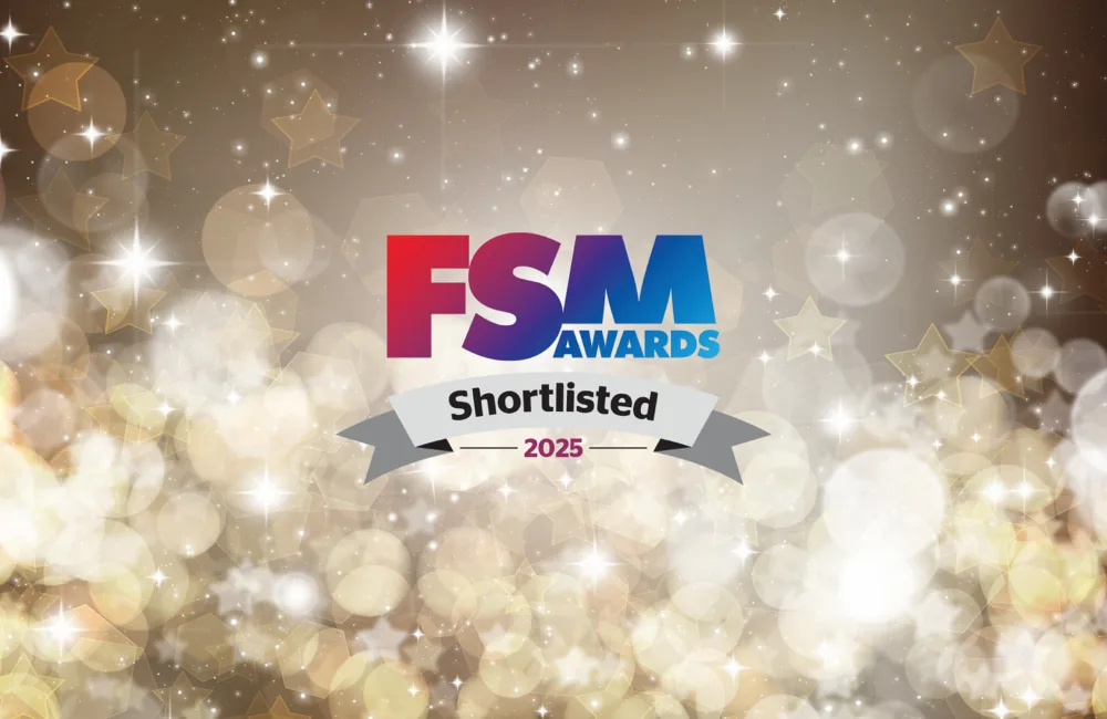 FSM Logo against a black and gold spakly background