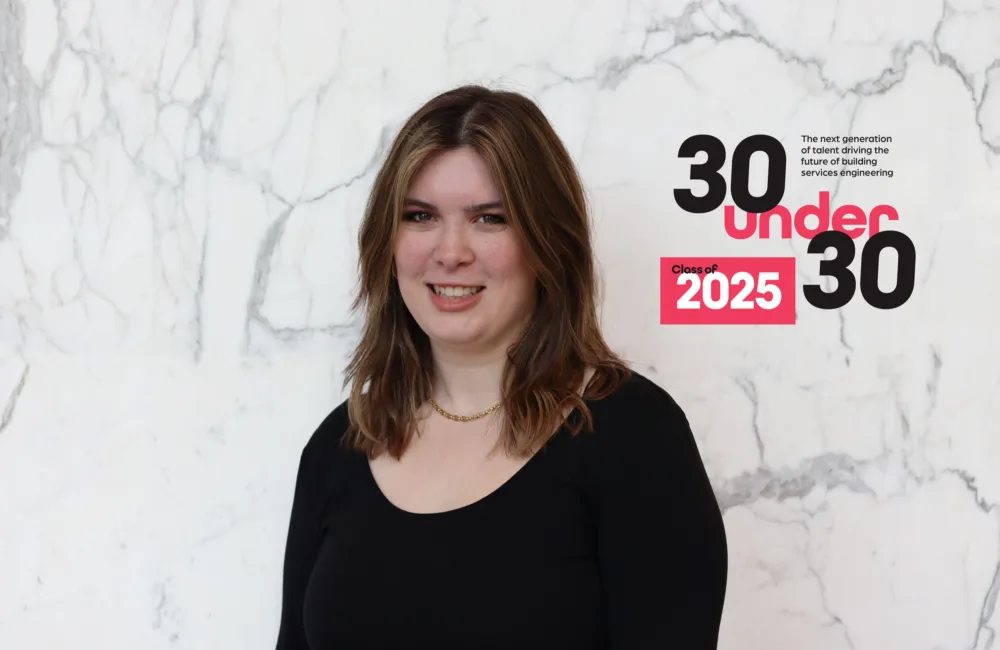 Jennifer is wearing a black top and gold necklace stands against a white marble wall. To the right, bold text reads “30 under 30” with “Class of 2025” in a red box and a smaller tagline: “The next generation of talent shaping the future of building services engineering.”