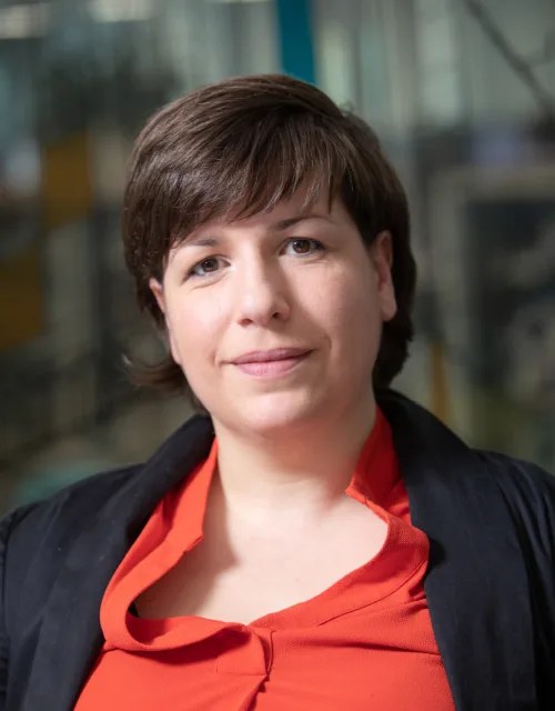 Aisa wearing red top in Edinburgh office