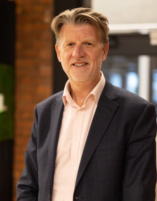 Paul Kenyon with office background