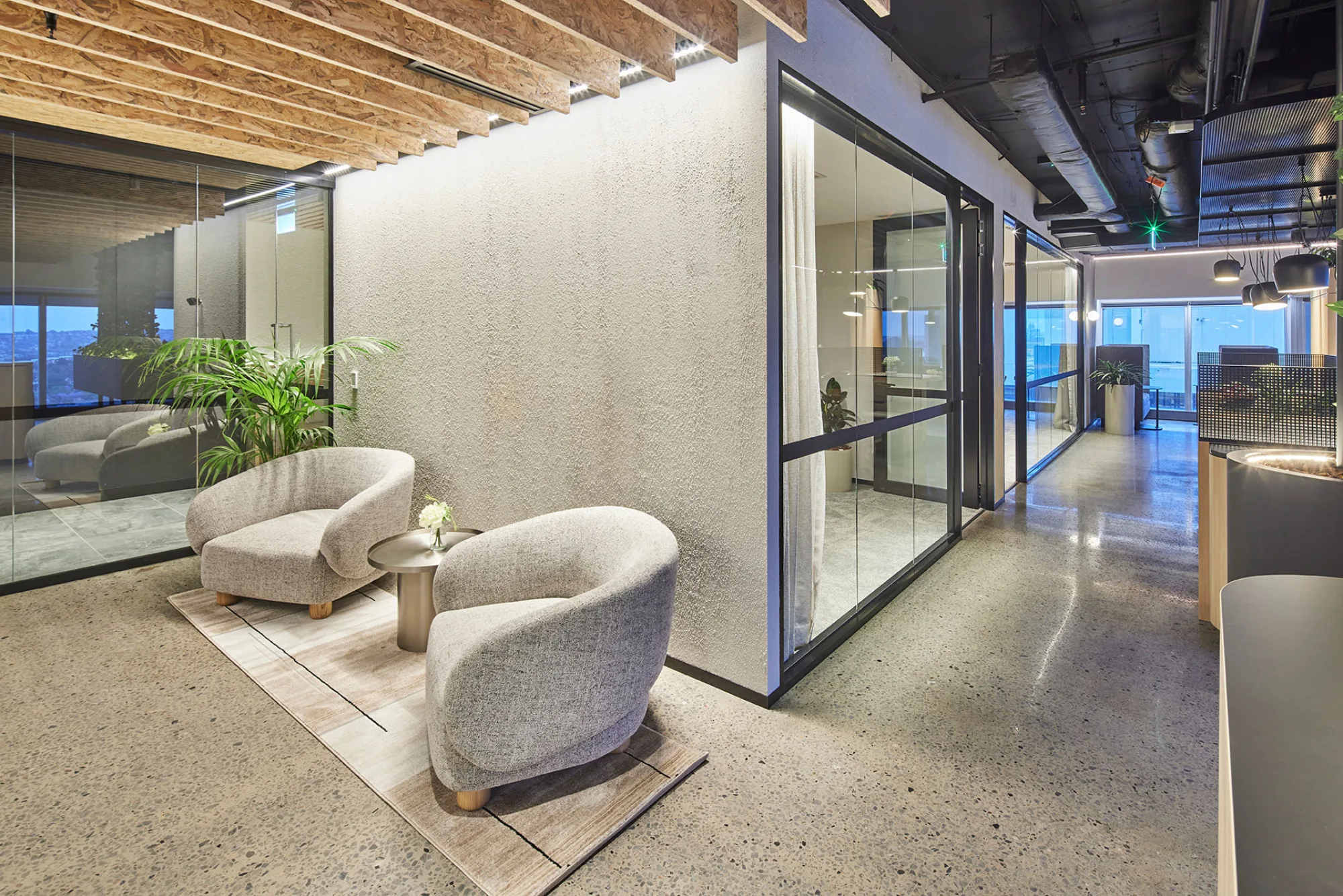 Office lobby and hallway leading to meeting rooms