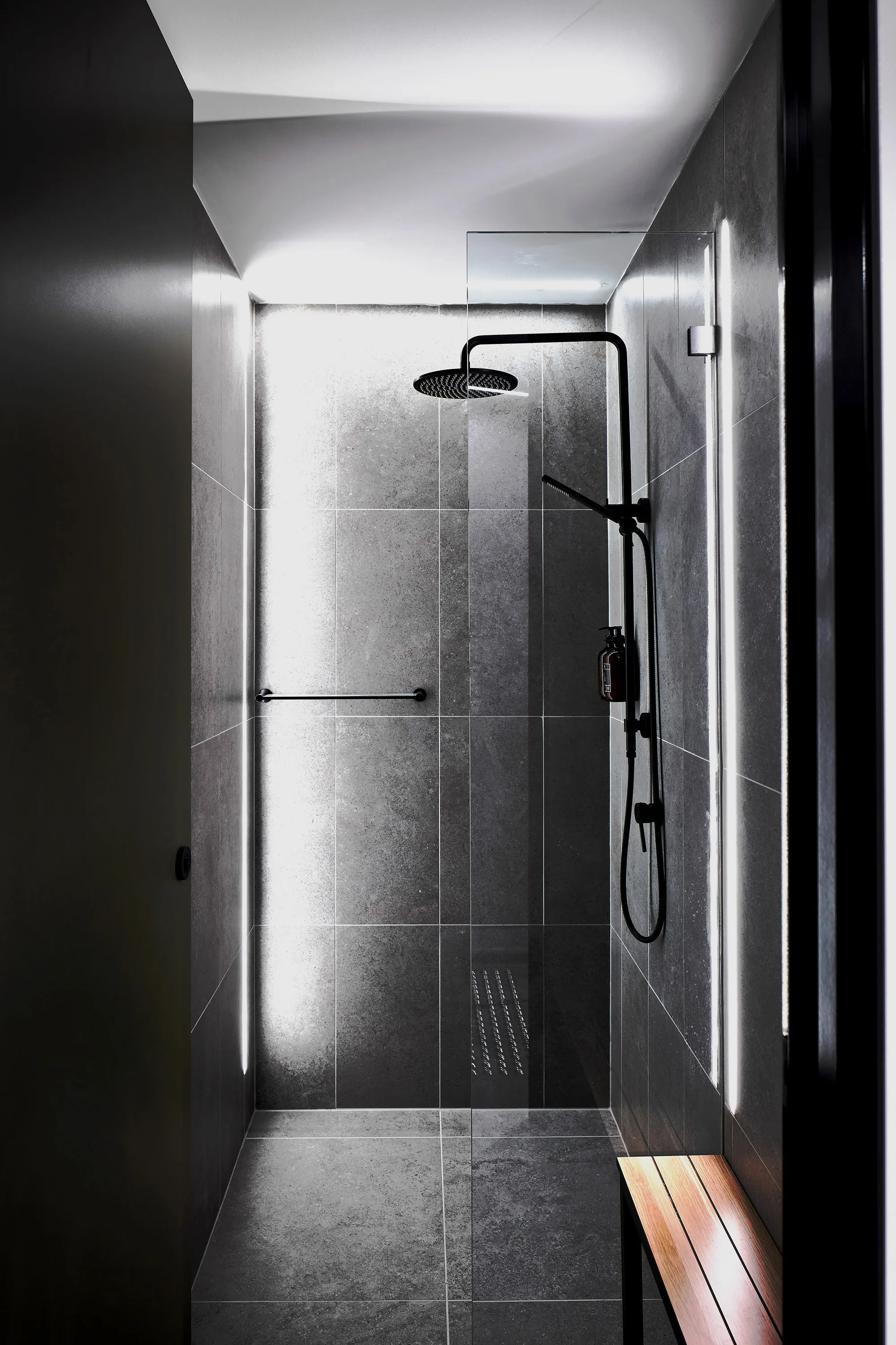 Dramatically lit shower room with bold lights