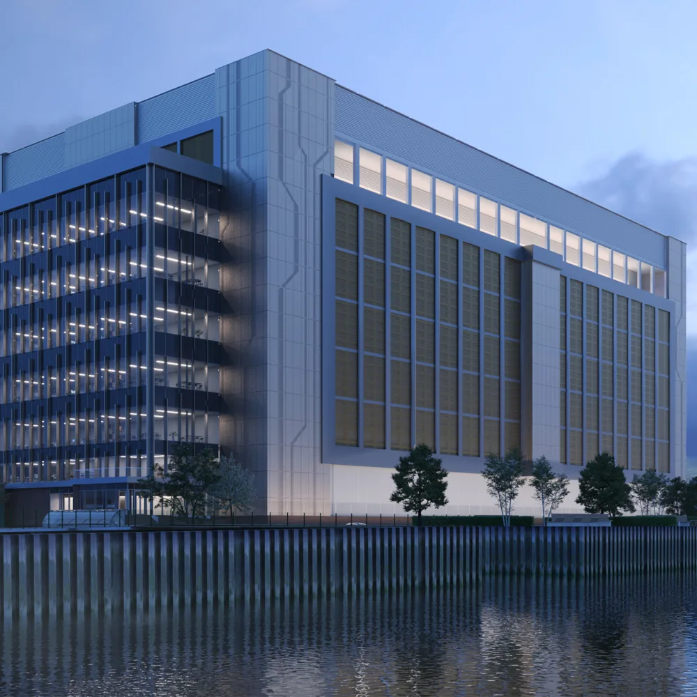 Evening view of Ada Infrastructures Docklands Data Centre from the water