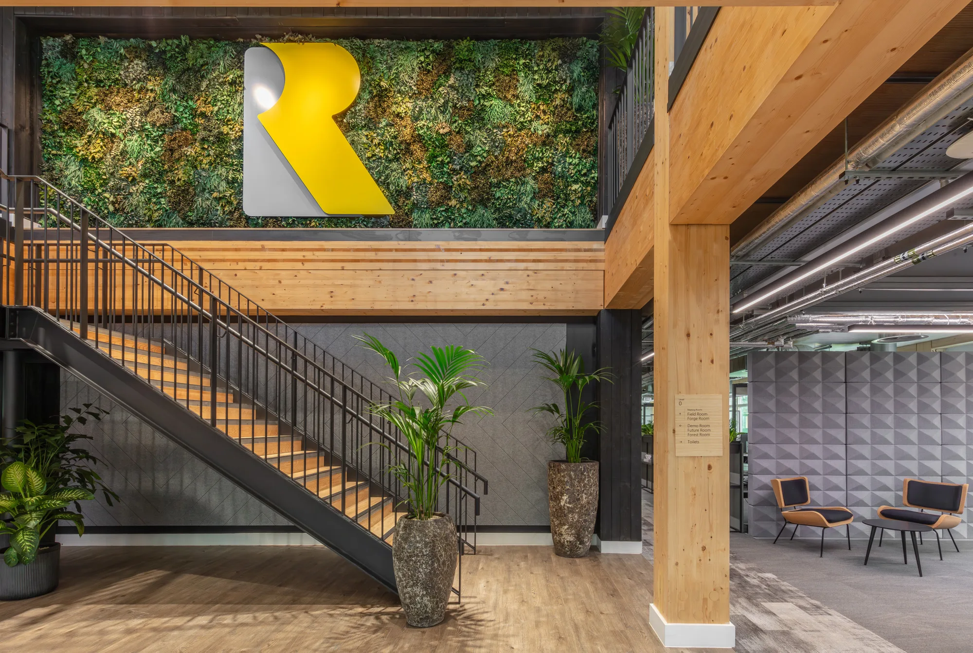 Internal shot of office showing green wall and R logo
