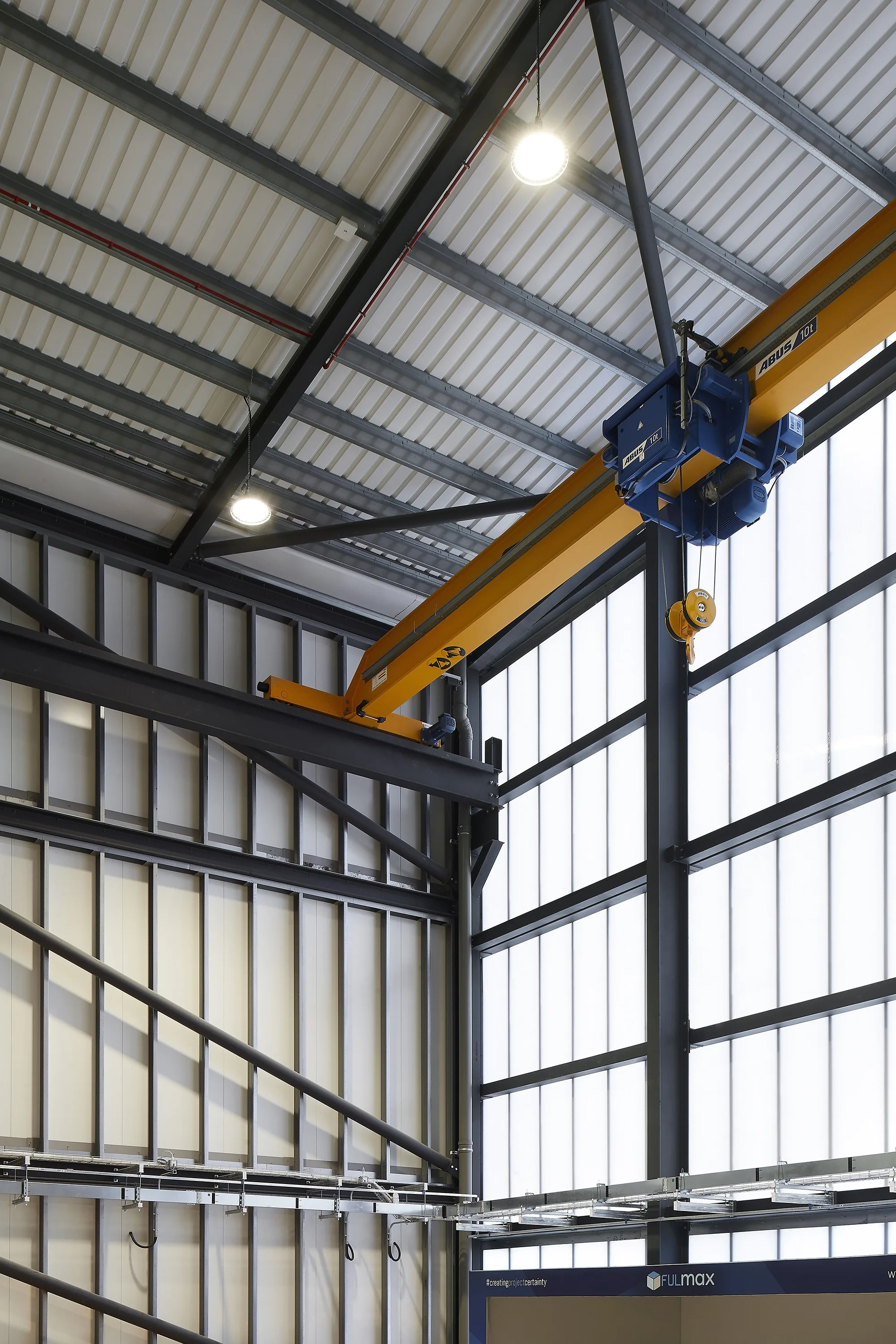 Interior of the building showing the exposed metal frame of the walls and ceiling