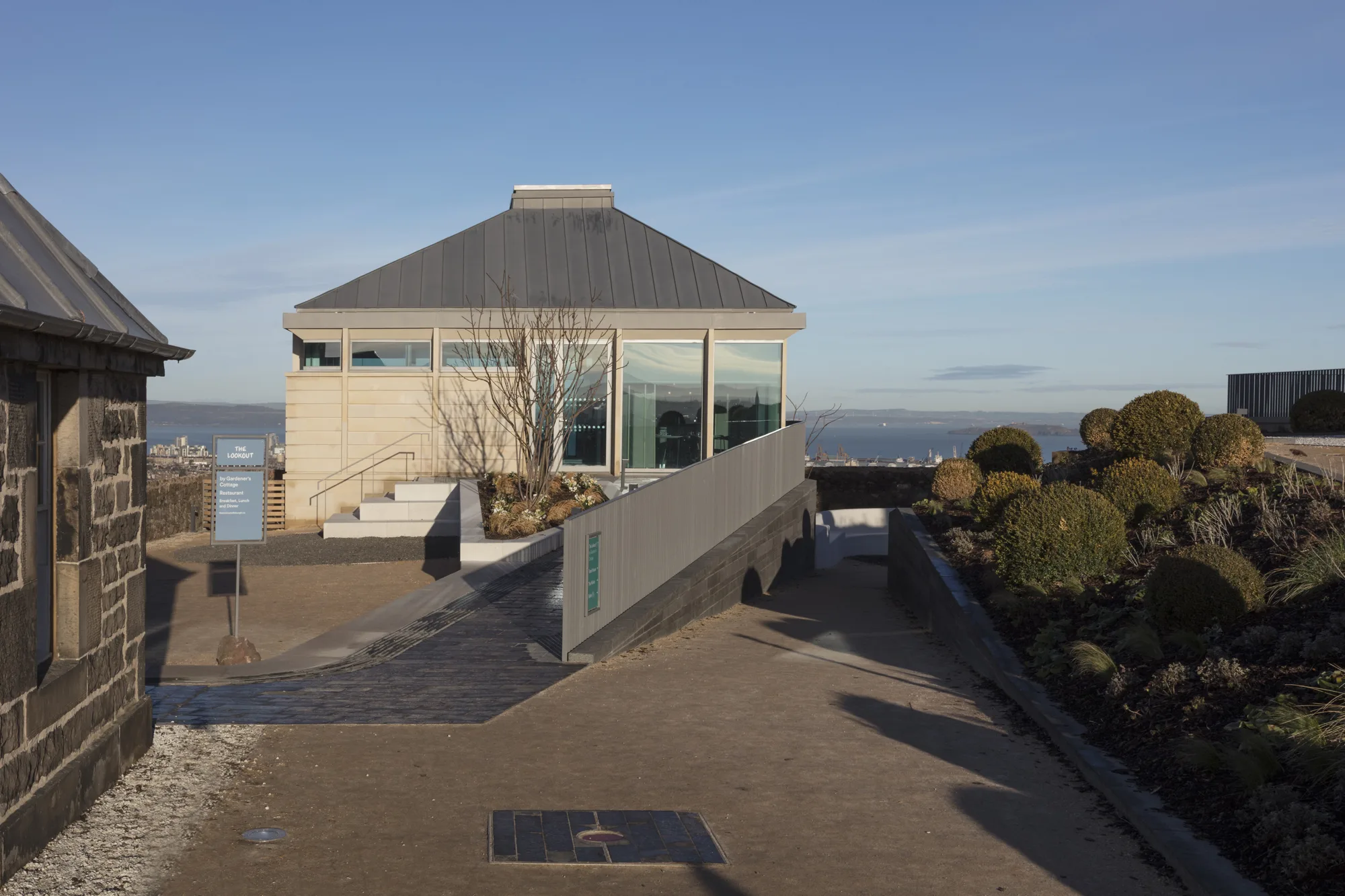 The look out building with stair and ramp access and views of Edinburgh in the background