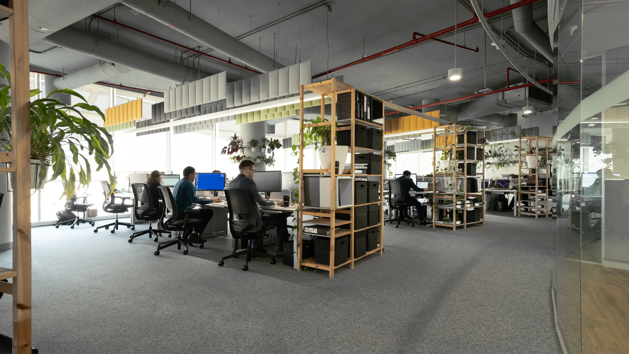 Cundall Qatar office workstations with people working