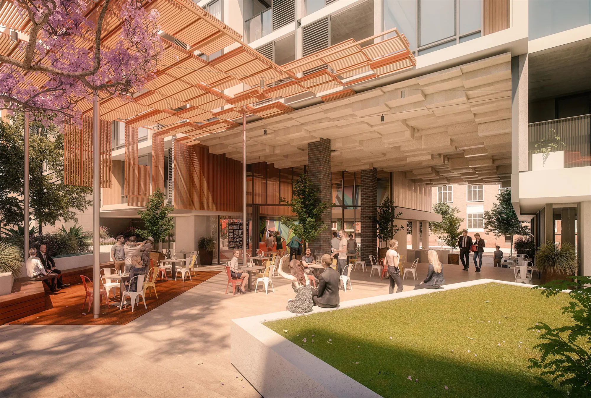 Exterior shot of people drinking at tables in the café unit located at the bottom of the apartment block