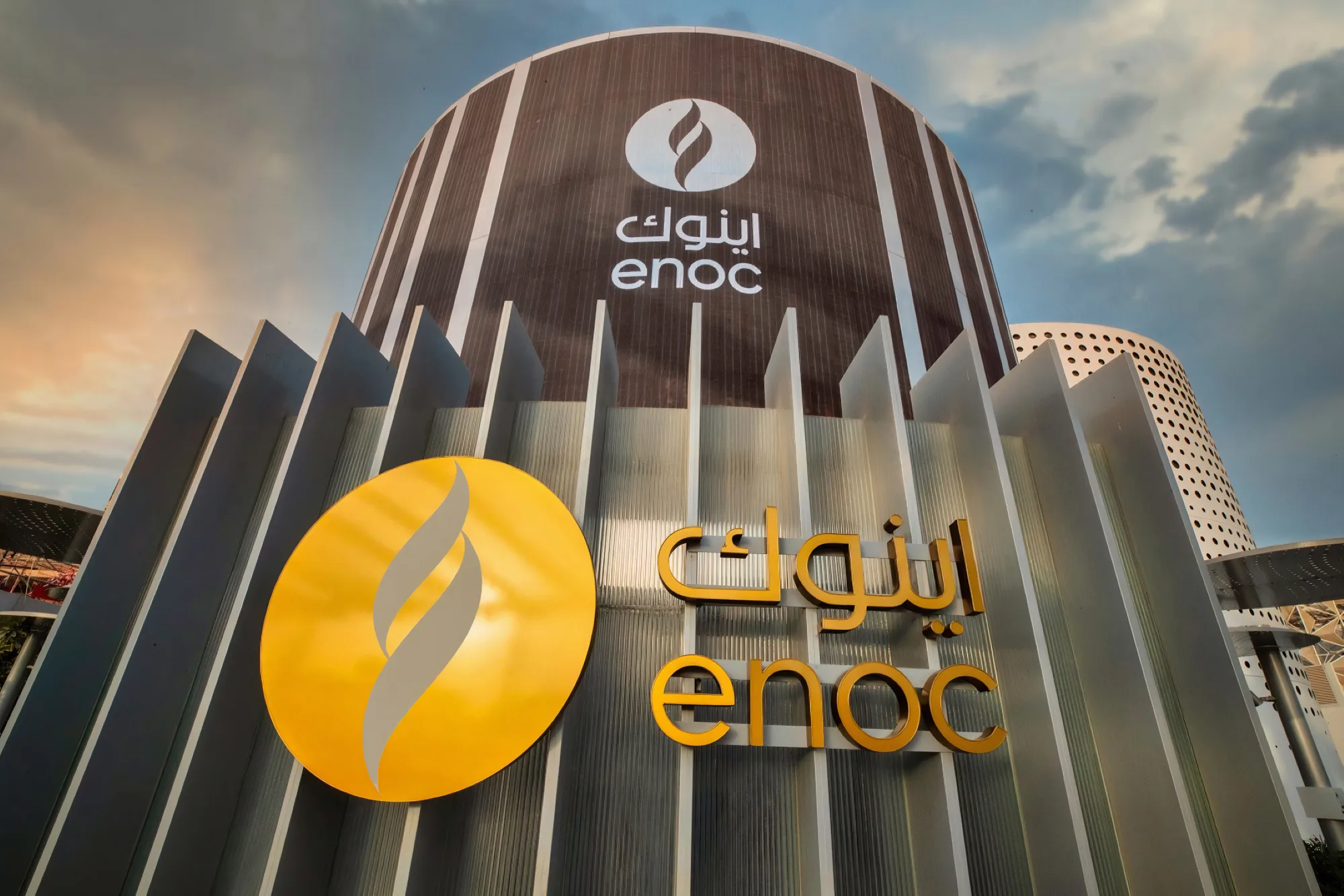 Front view of the ENOC Pavillion at the EXPO 2020 in Dubai. The ENOC logo is large and visible
