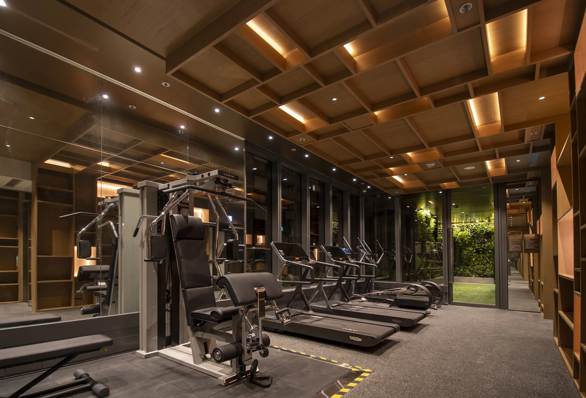 Gym with exercise equipment featuring interior ceiling lighting.