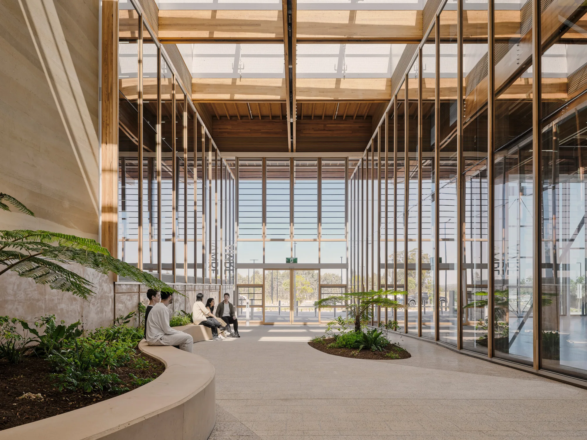 Building entrance featuring rammed earth walls