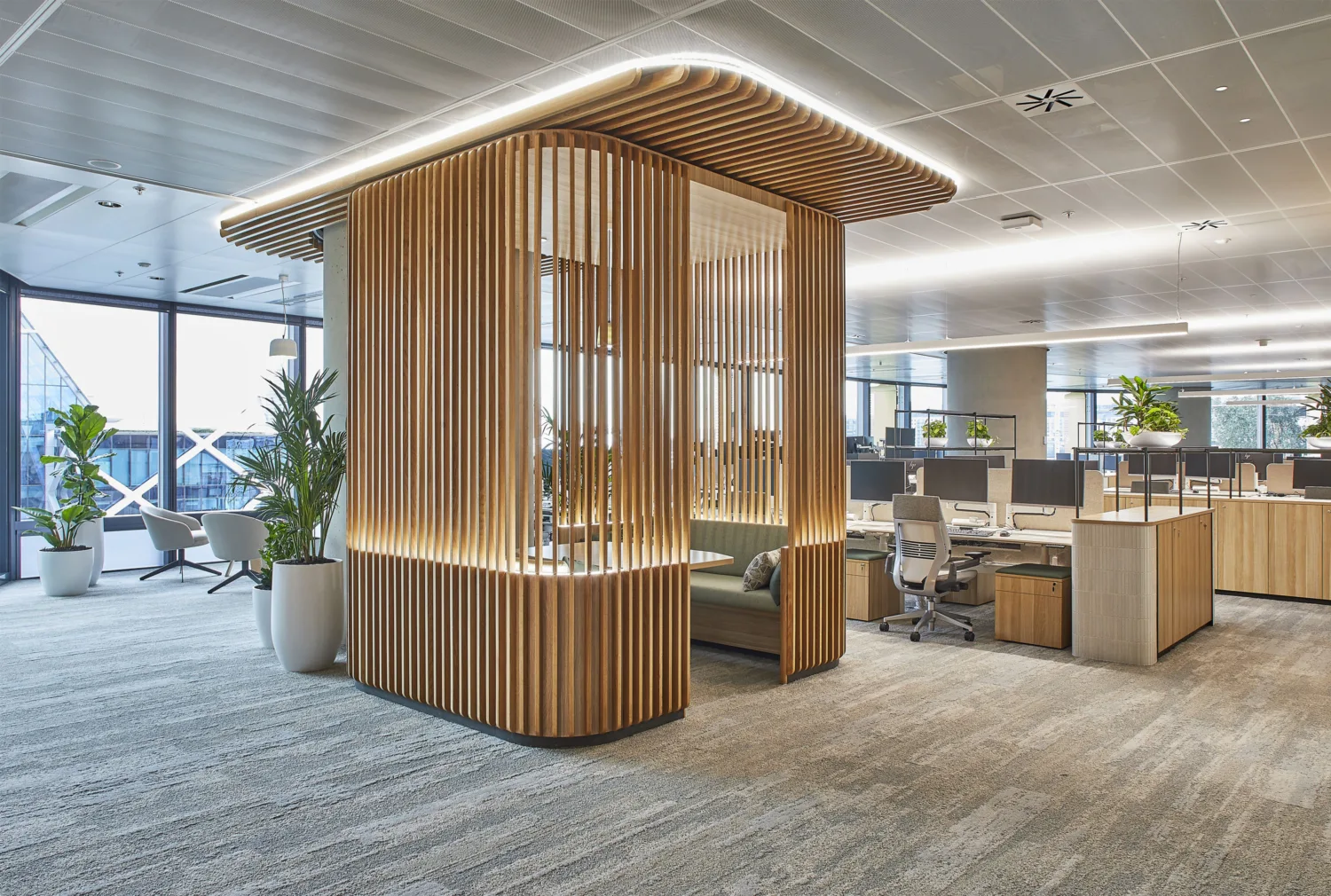 Individual work pod space centred in an open plan office