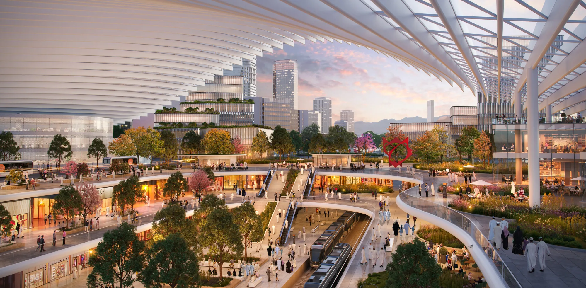Multilevel urban plaza with trees, wide walkways, and groups of people. Curved elevated paths overlook trains on lower platforms. Surrounding buildings have glass facades, and a large patterned roof structure spans overhead at sunset.