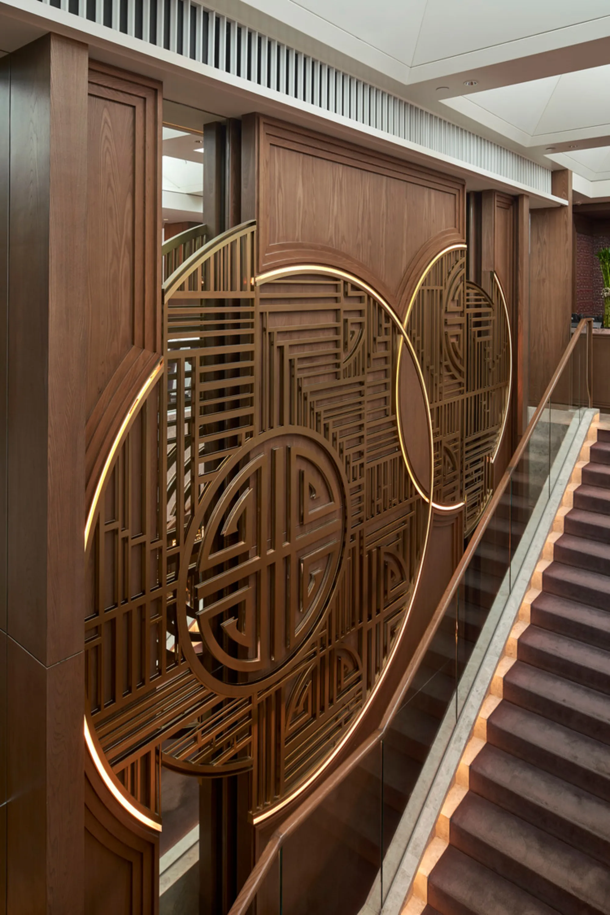 Chinese-style wall décor with special lighting design along staircase