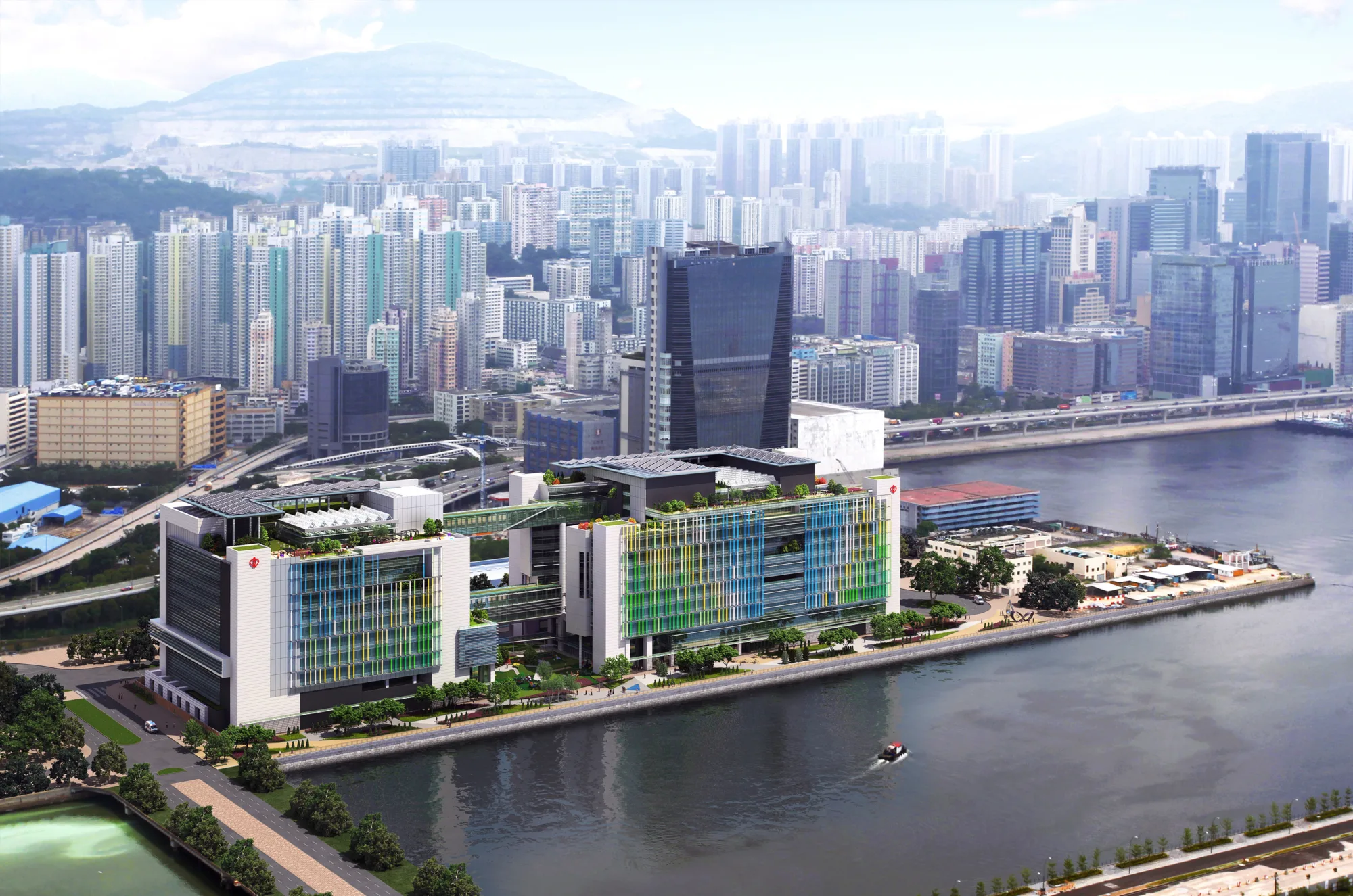 A long hospital building with a colourful façade which complements its prime waterfront position