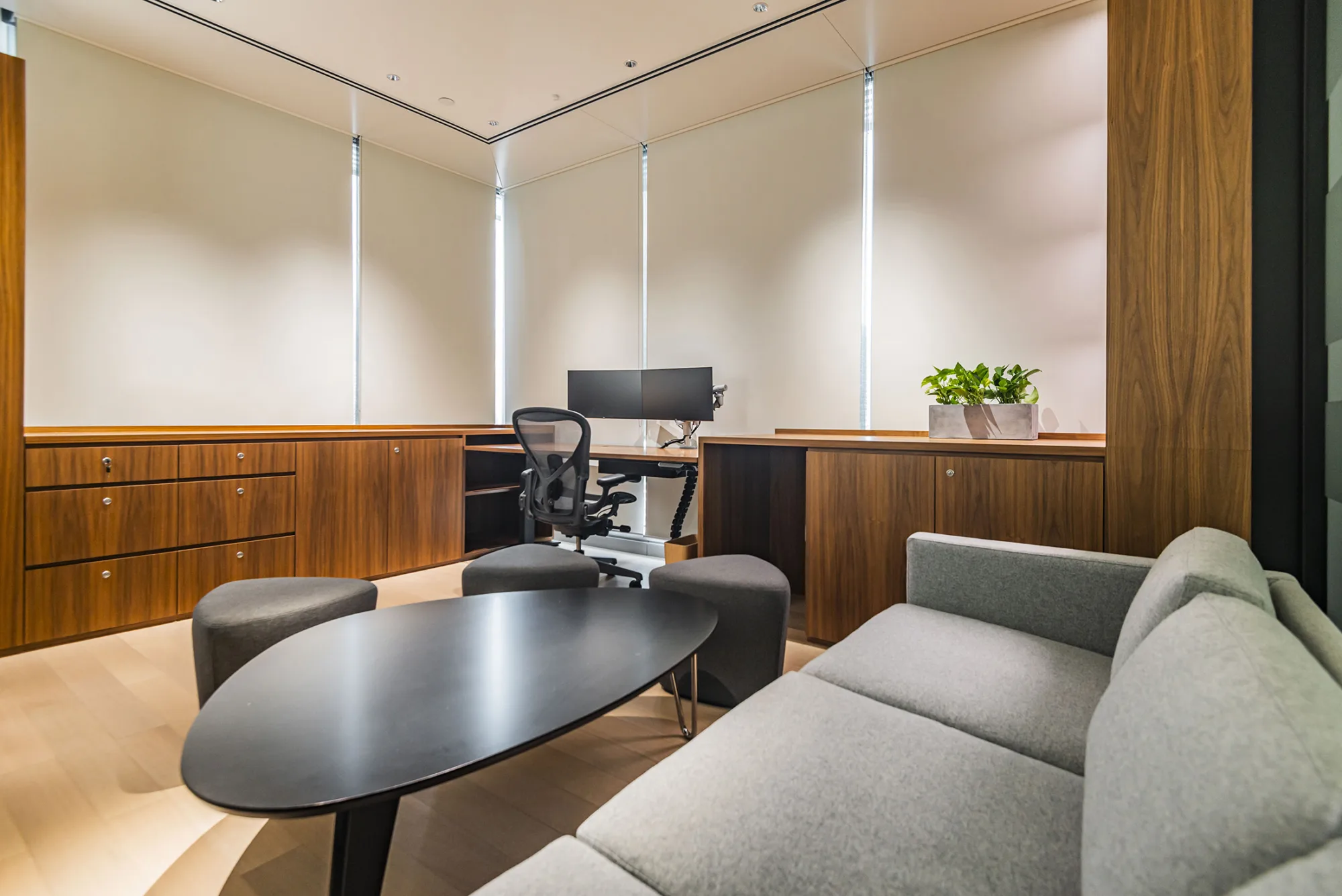 Interior shot of the manager room with sofa, table, and three chairs
