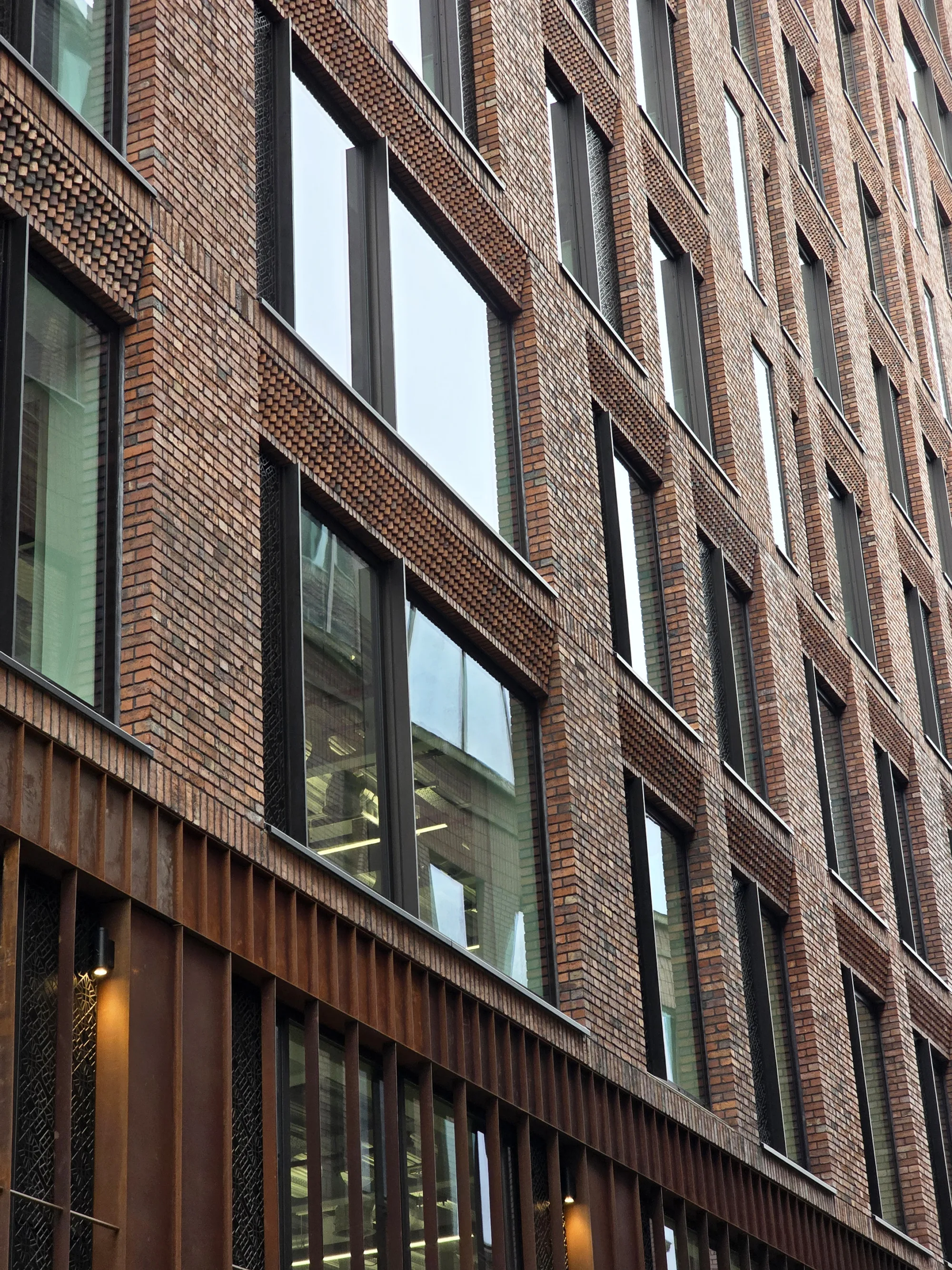 Front of the Island Site building, zooming into the bottom level windows