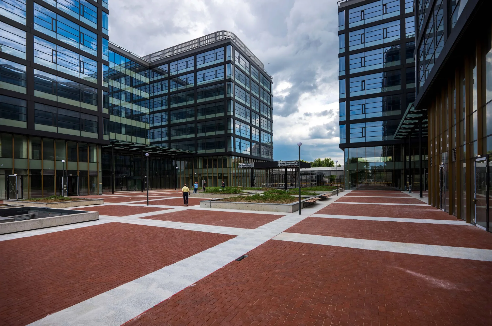 Photograph of the buildings entrance and pedestrianised courtyard