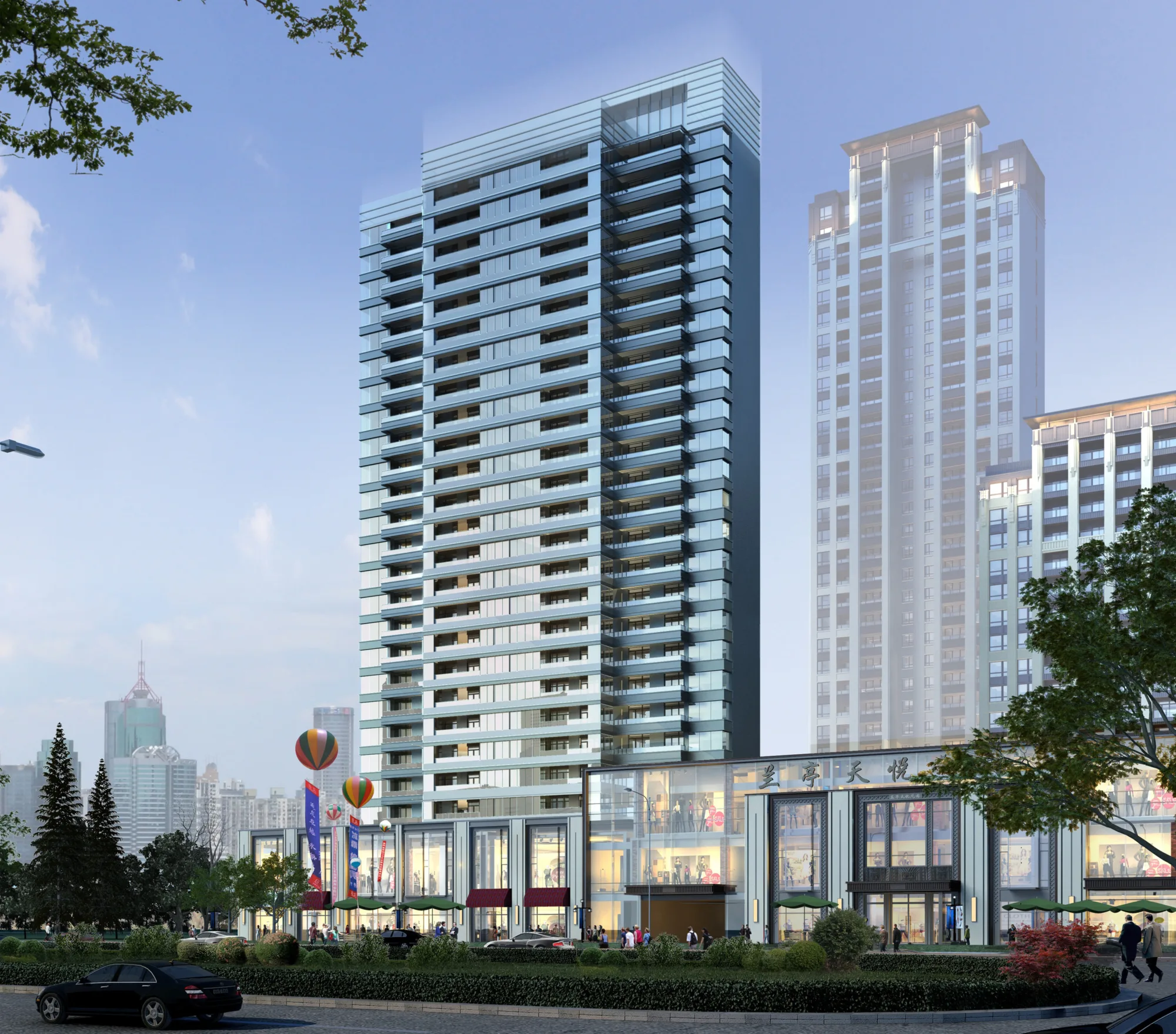 Street-level view of development featuring retail podium with glass windows in front of residential high-rise buildings