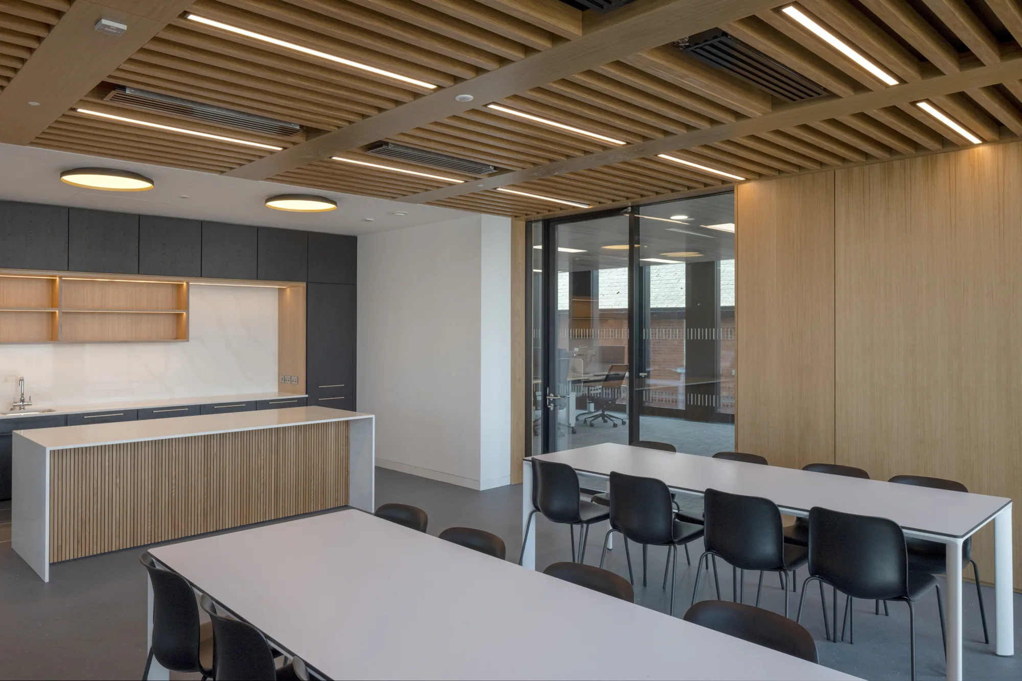 Kitchen area with timber panelling decorated throughout.