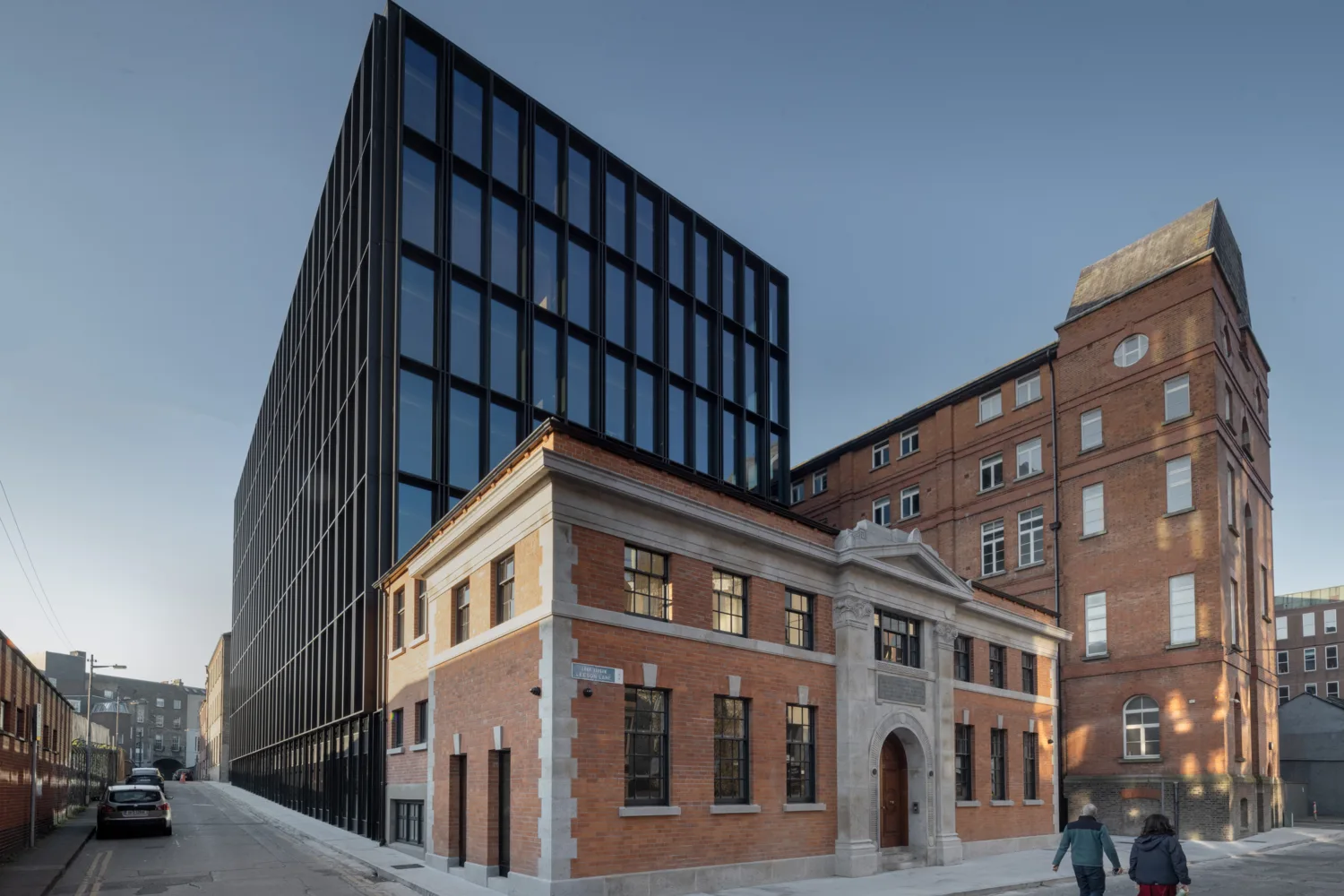 Exterior shot of Leeson Lane building in daylight.