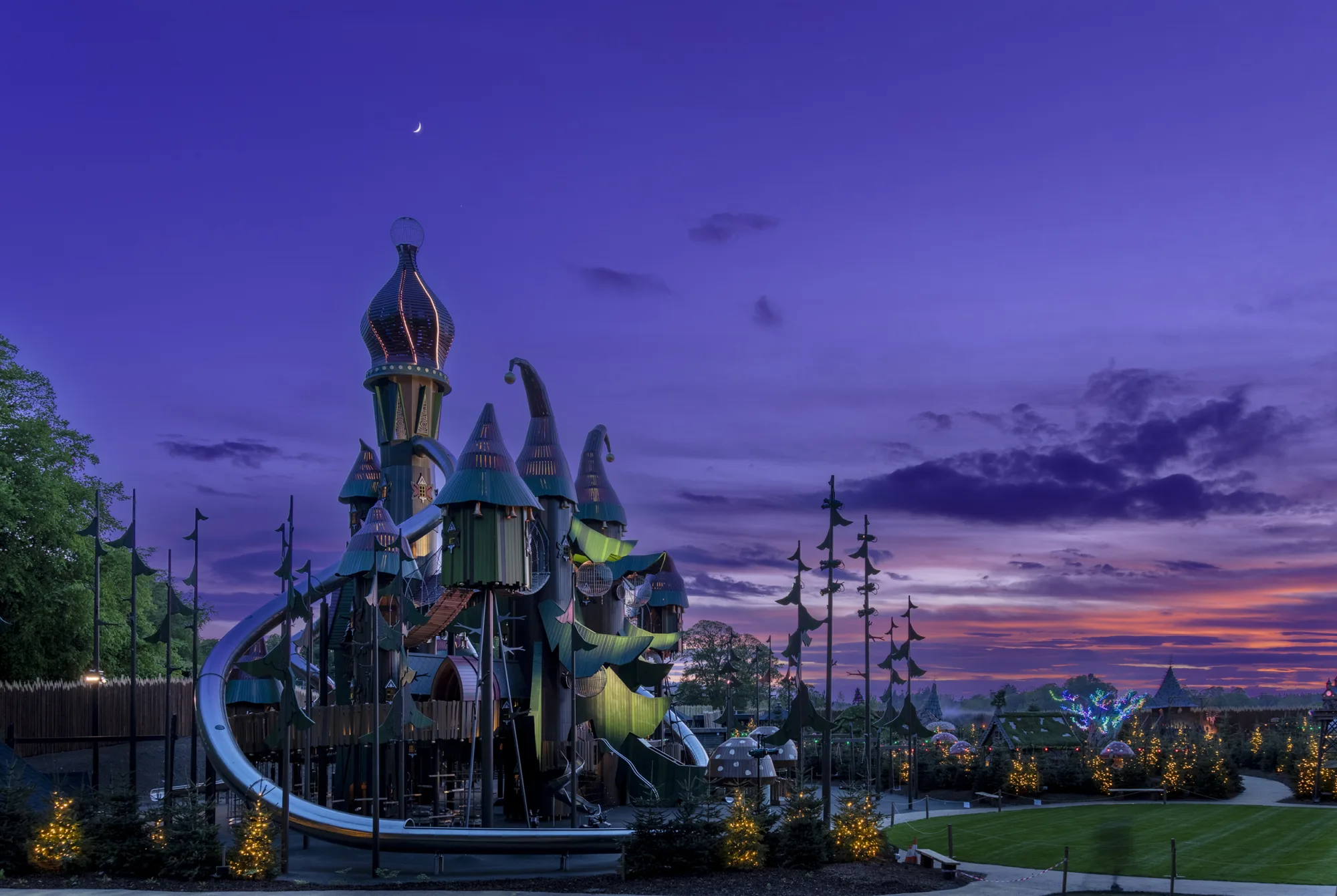 Lilidorei at Alnwick Garden at dusk showing play area and grass lawn in front of space