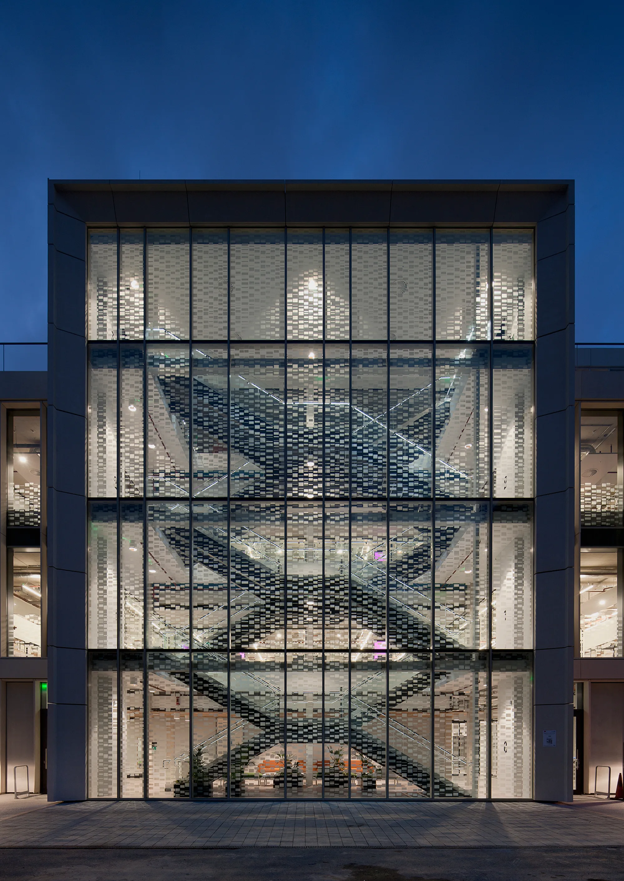 London Institute of Healthcare Engineering façade at night with lighting of staircase