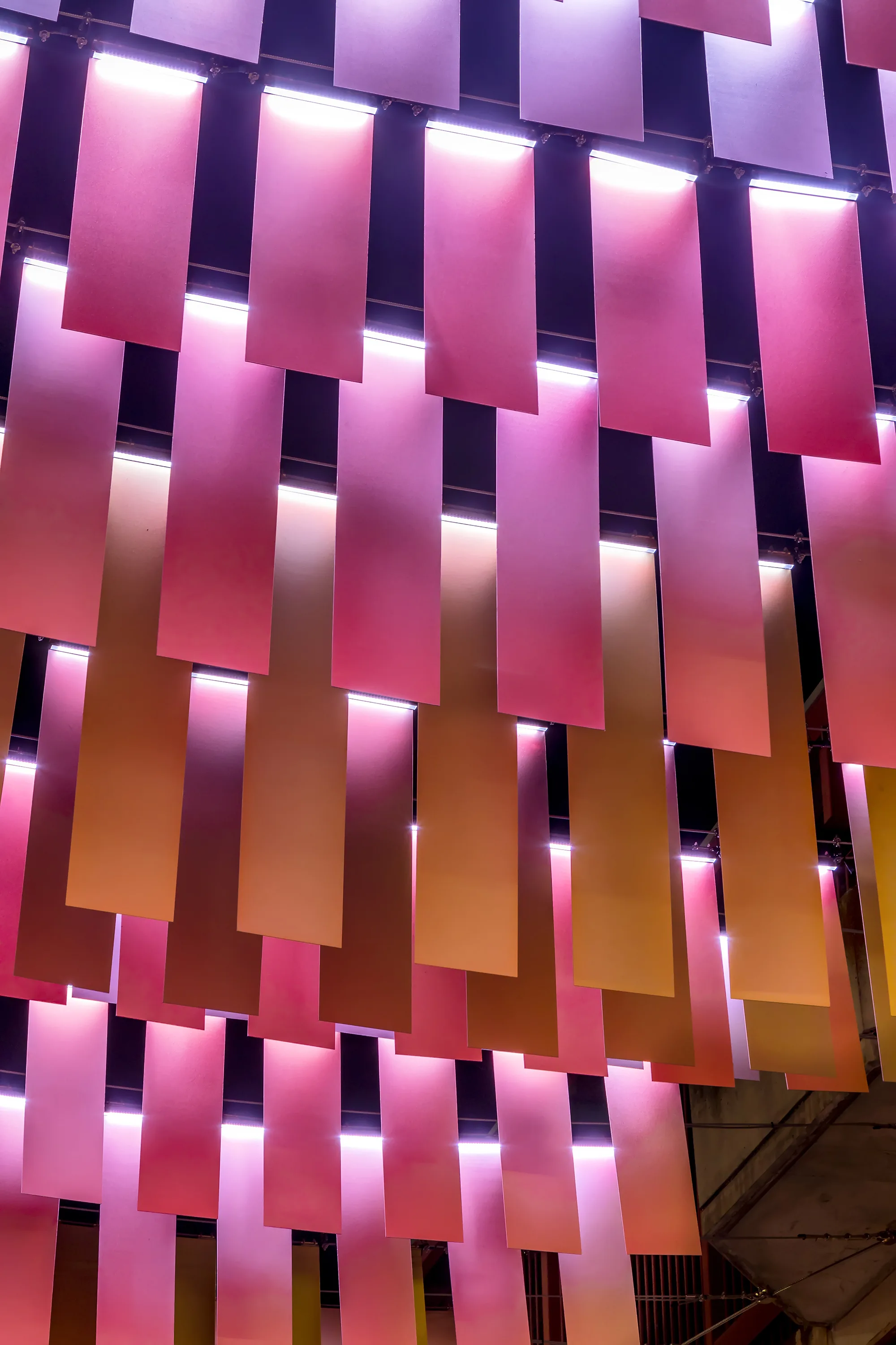 Close up of art installation at Moonta Street with hanging light fittings representing money bags.