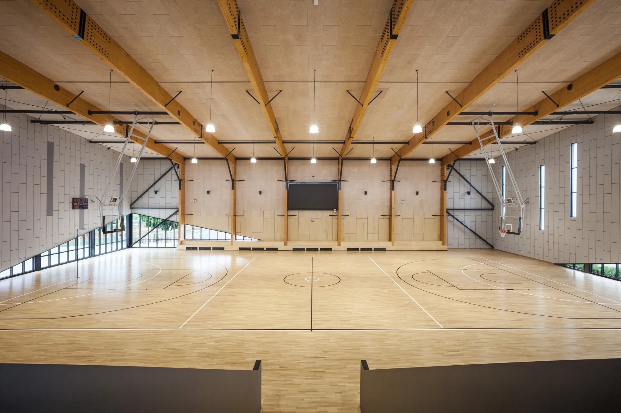 Interior of sports venue suitable for court games.