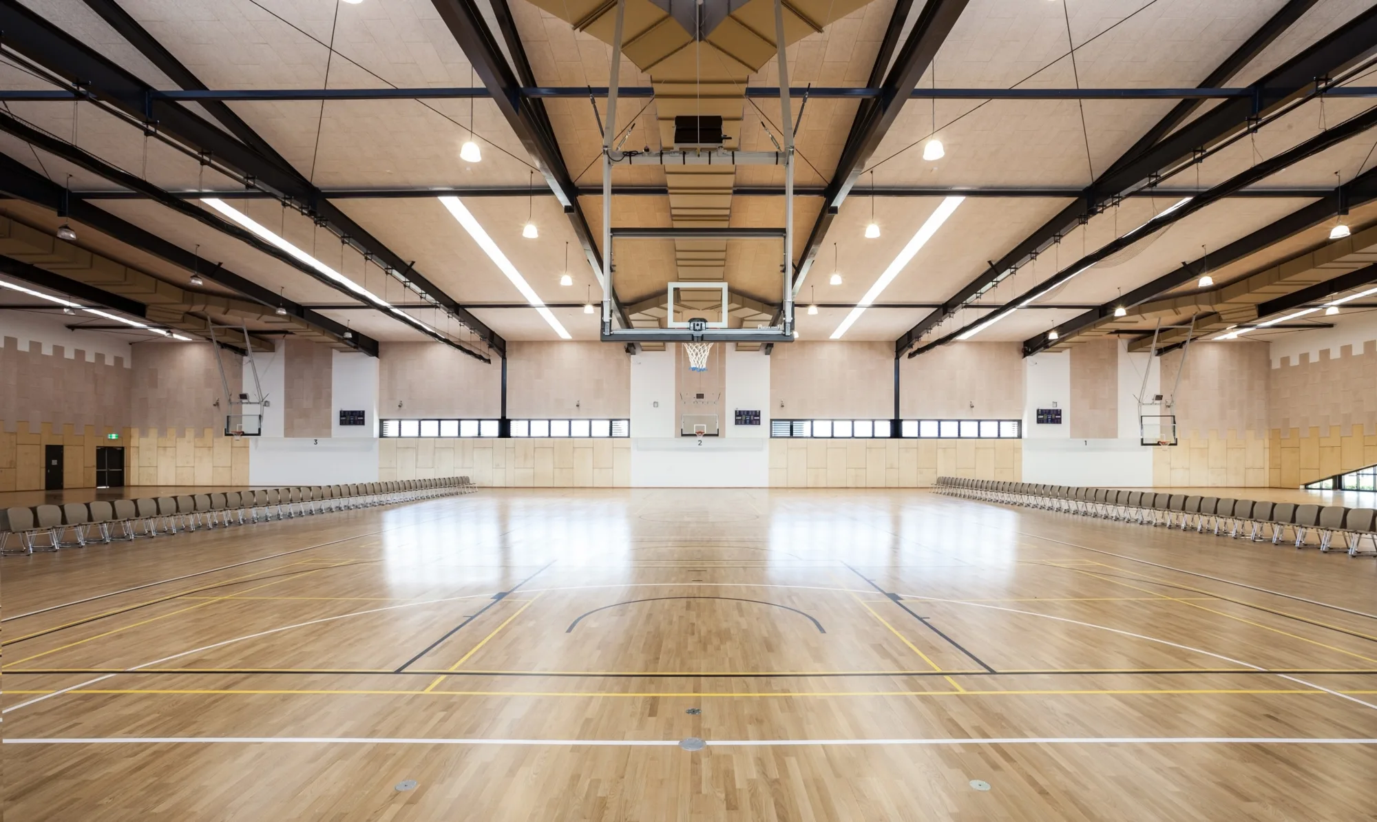 Interior of sports venue suitable for court games.