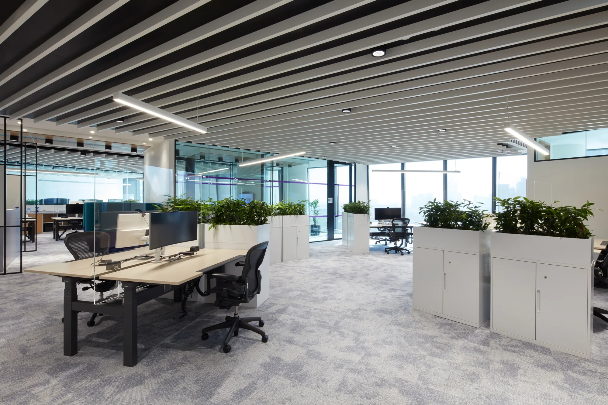Natixis Dubai office spacious workstations with cupboards