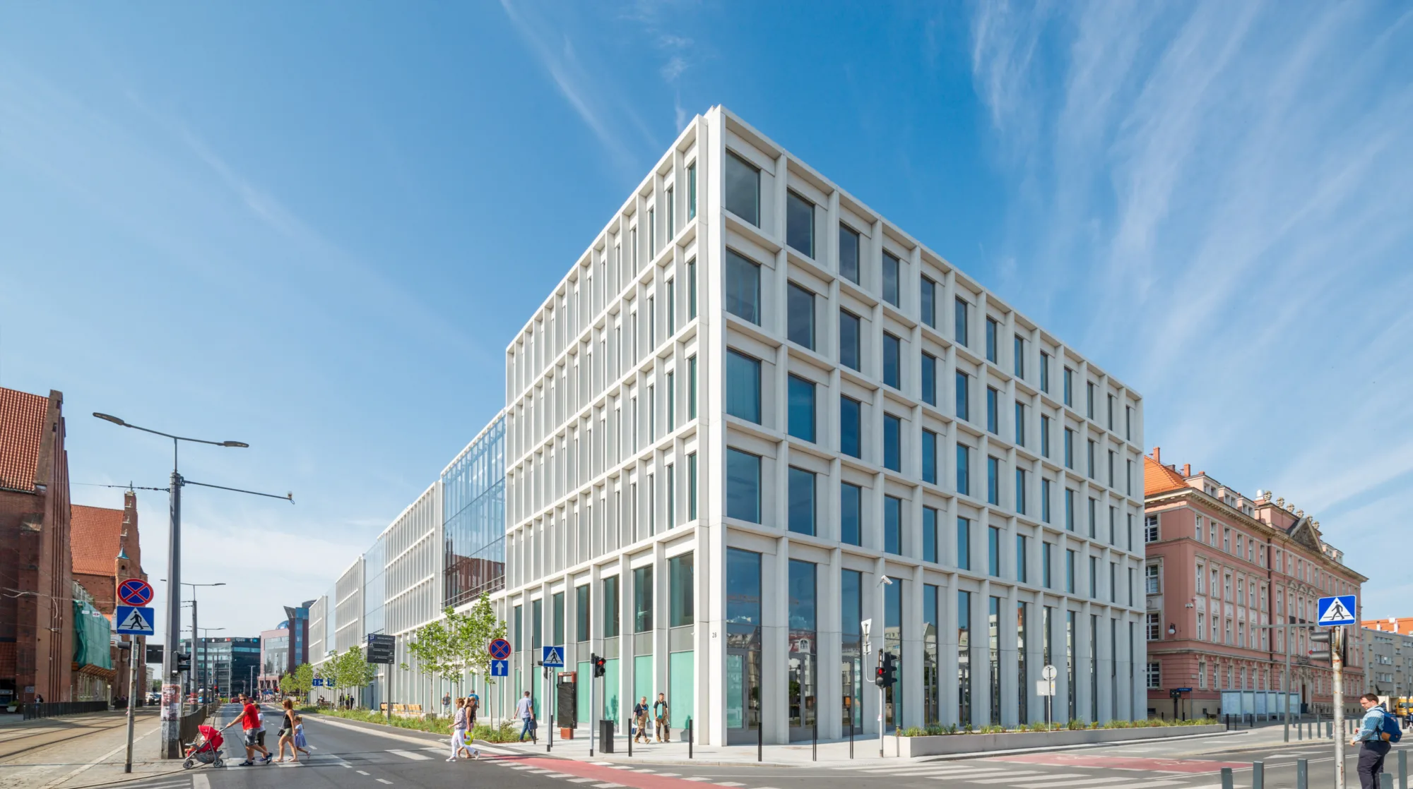 A day shot of exterior of the office building with a blue sky