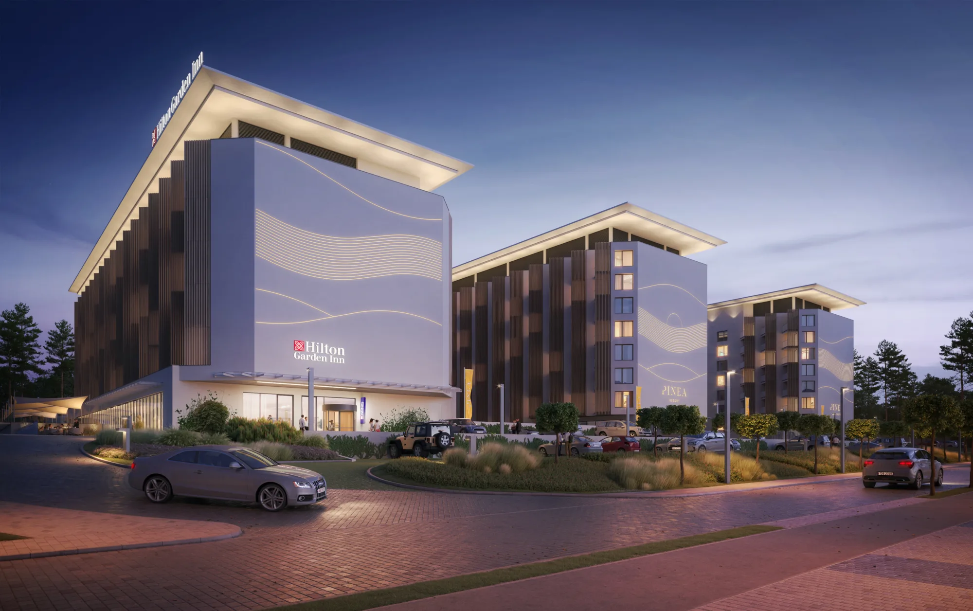 Exterior of three Hilton building and the evening sky