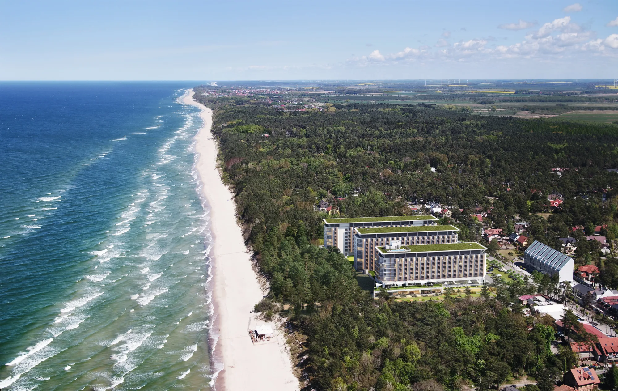 Baltic sea, the beach and the hotel grounds surrounded by a forest