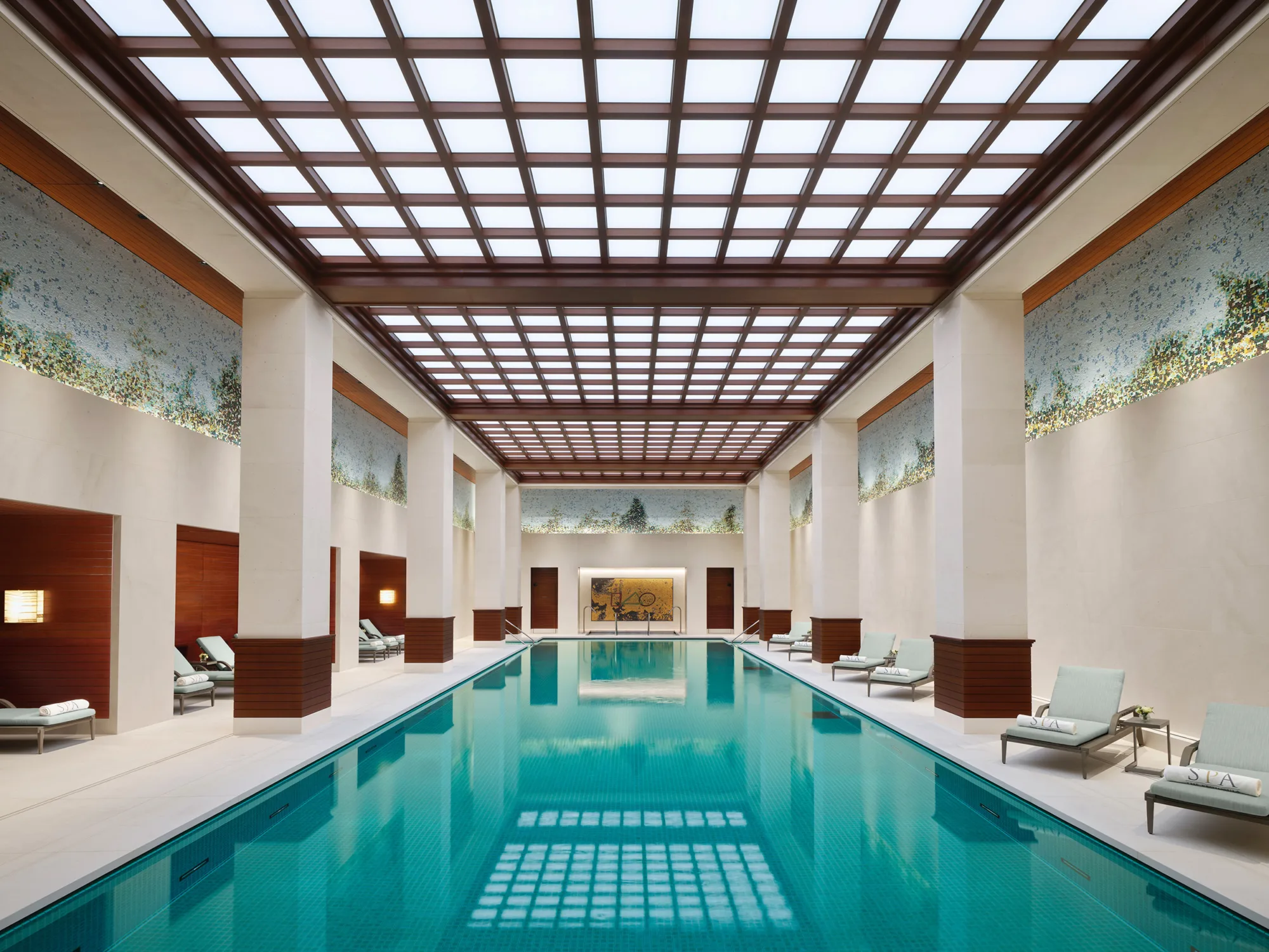 Peninsula Hotel swimming pool with lounge beds surrounding