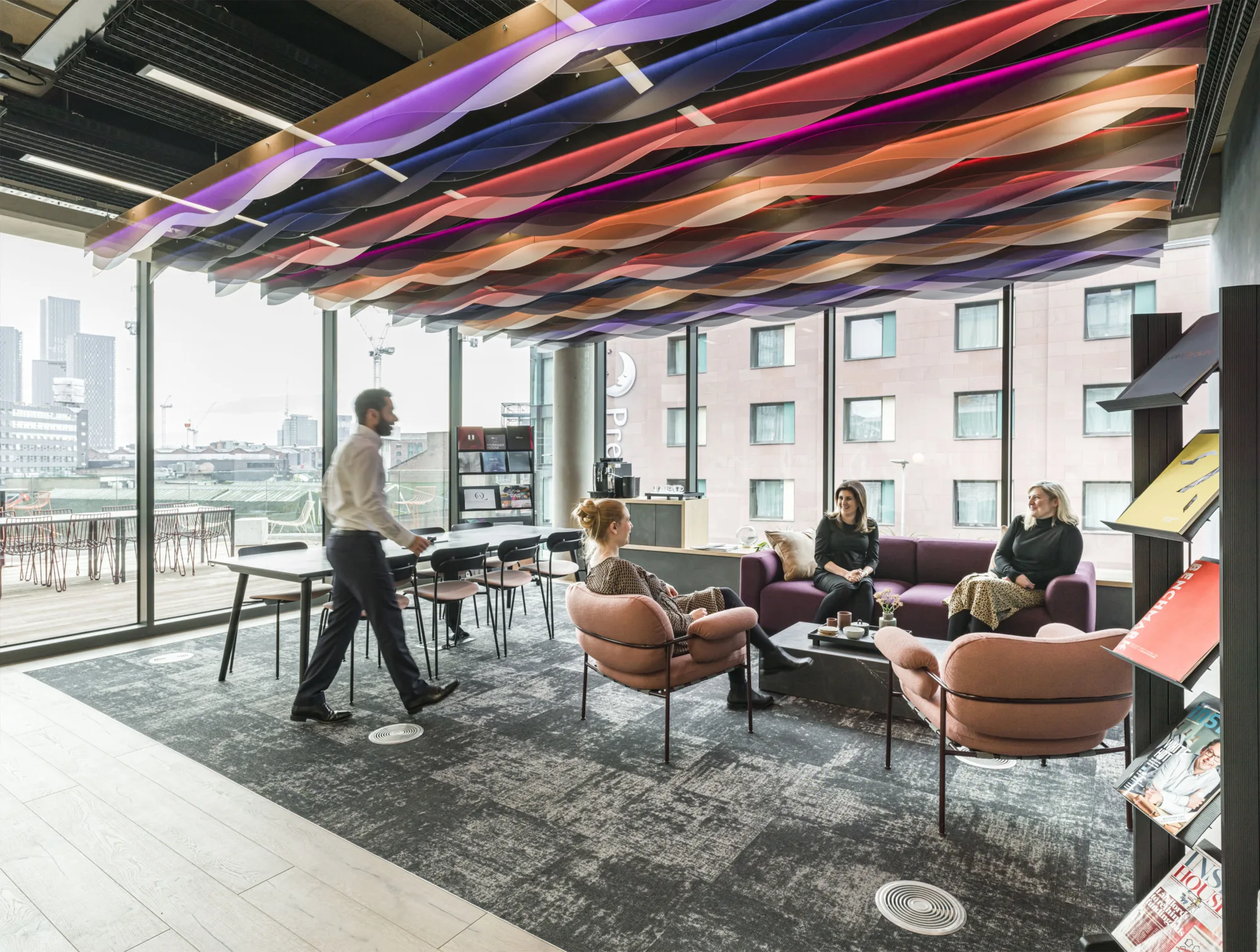 Collaboration area with colourful acoustic ceiling panels