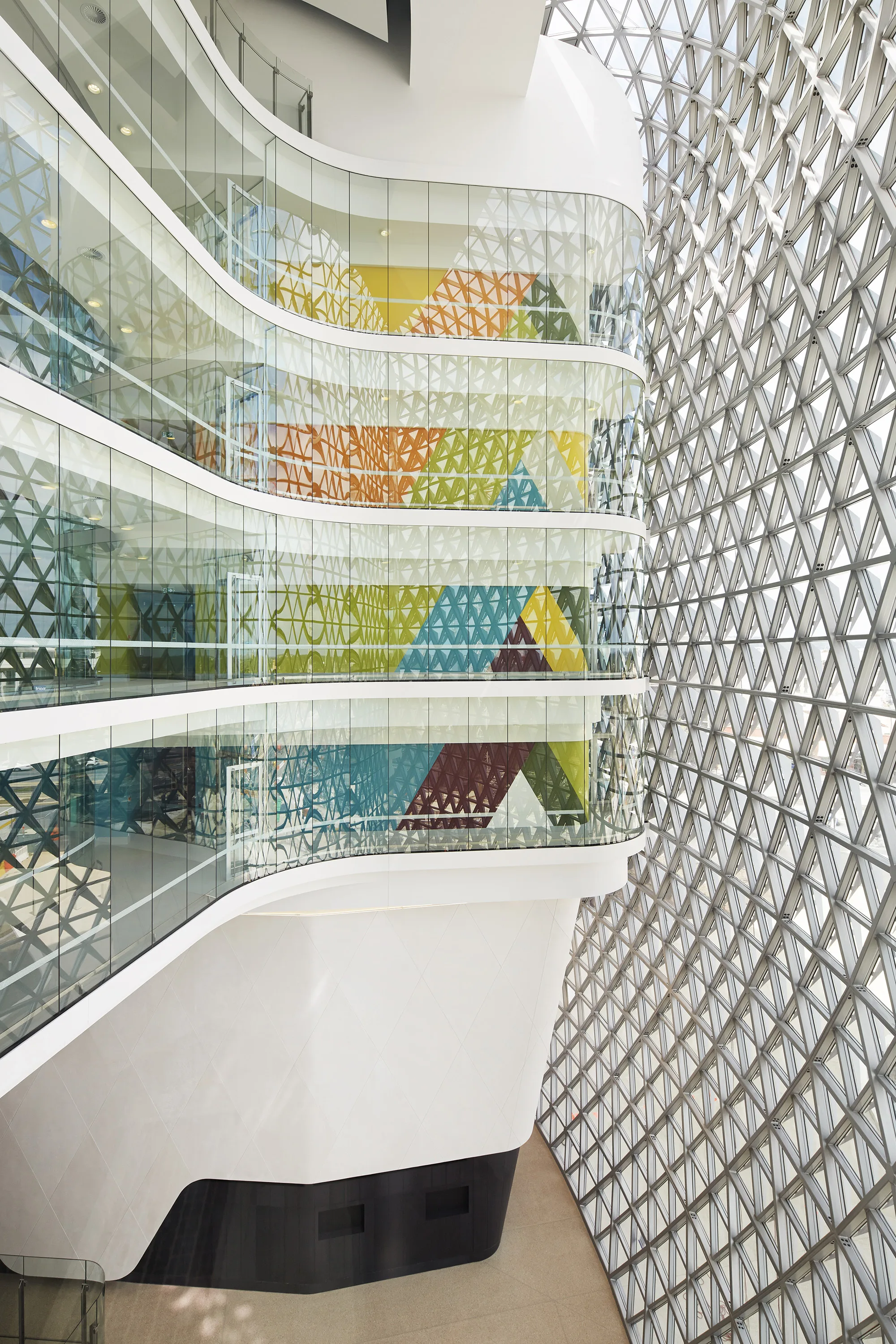 Interior view from foyer of external glass wall with detailing and internal levels.