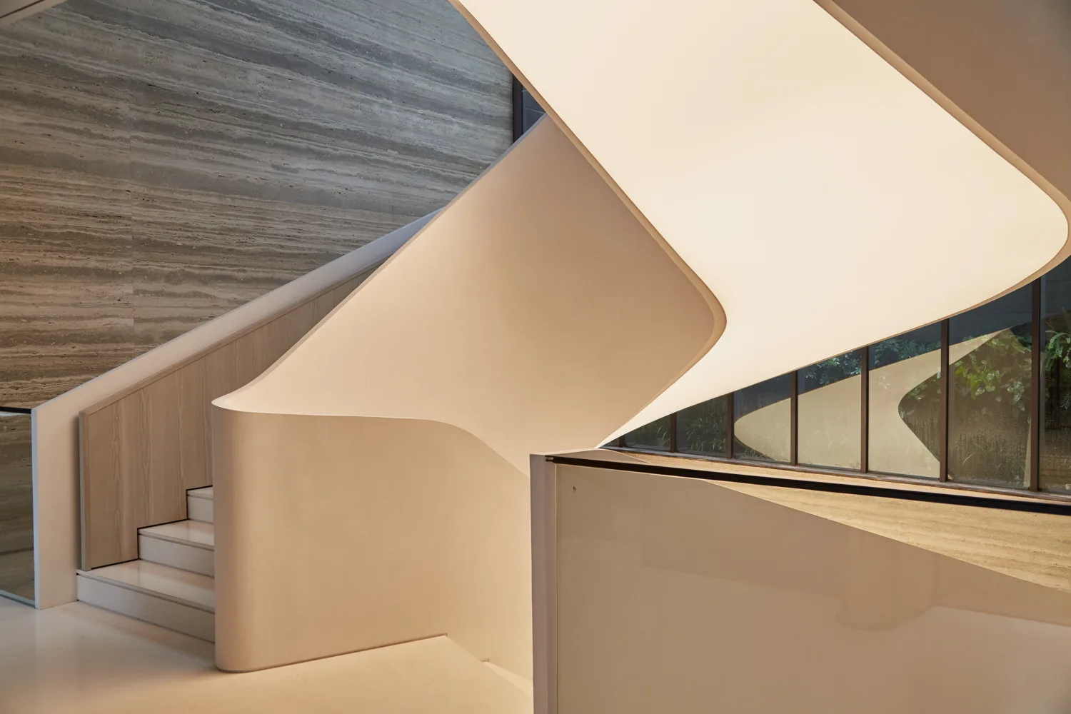 Spiral staircase featuring backlit soffit