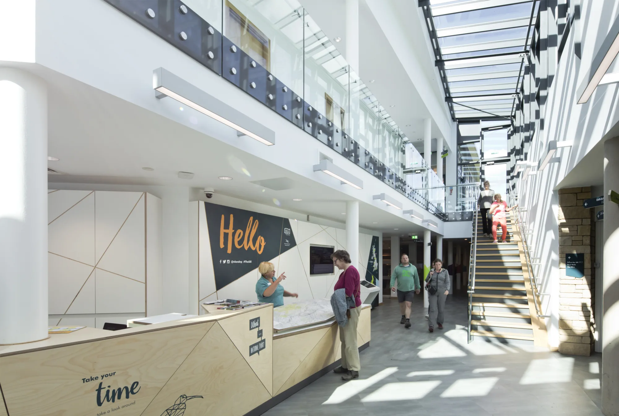 Interior of The Sill building, a white corridor lit from above through a window ceiling