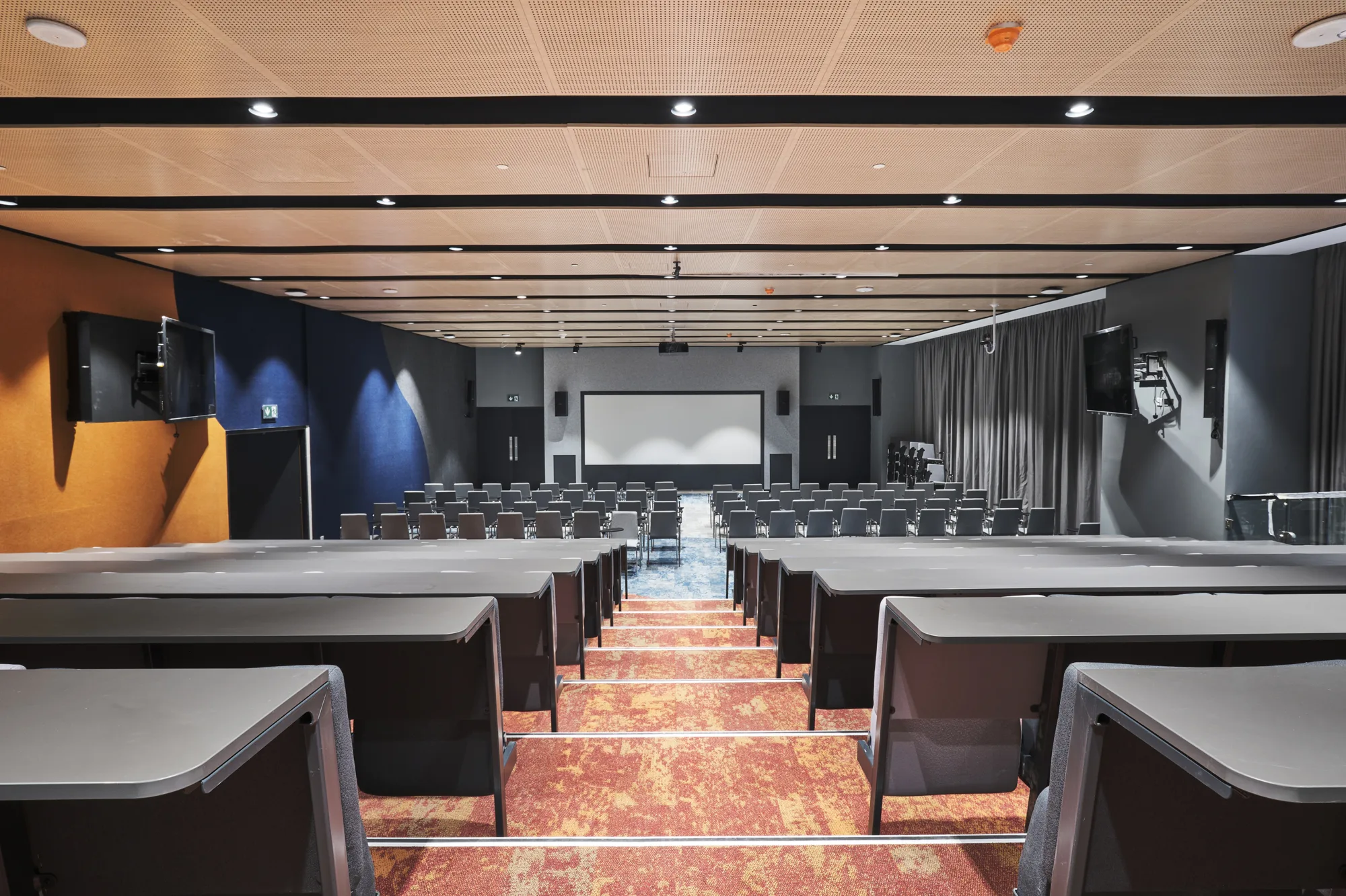 University Wollongong Dubai auditorium with theater like sound system and big screen.