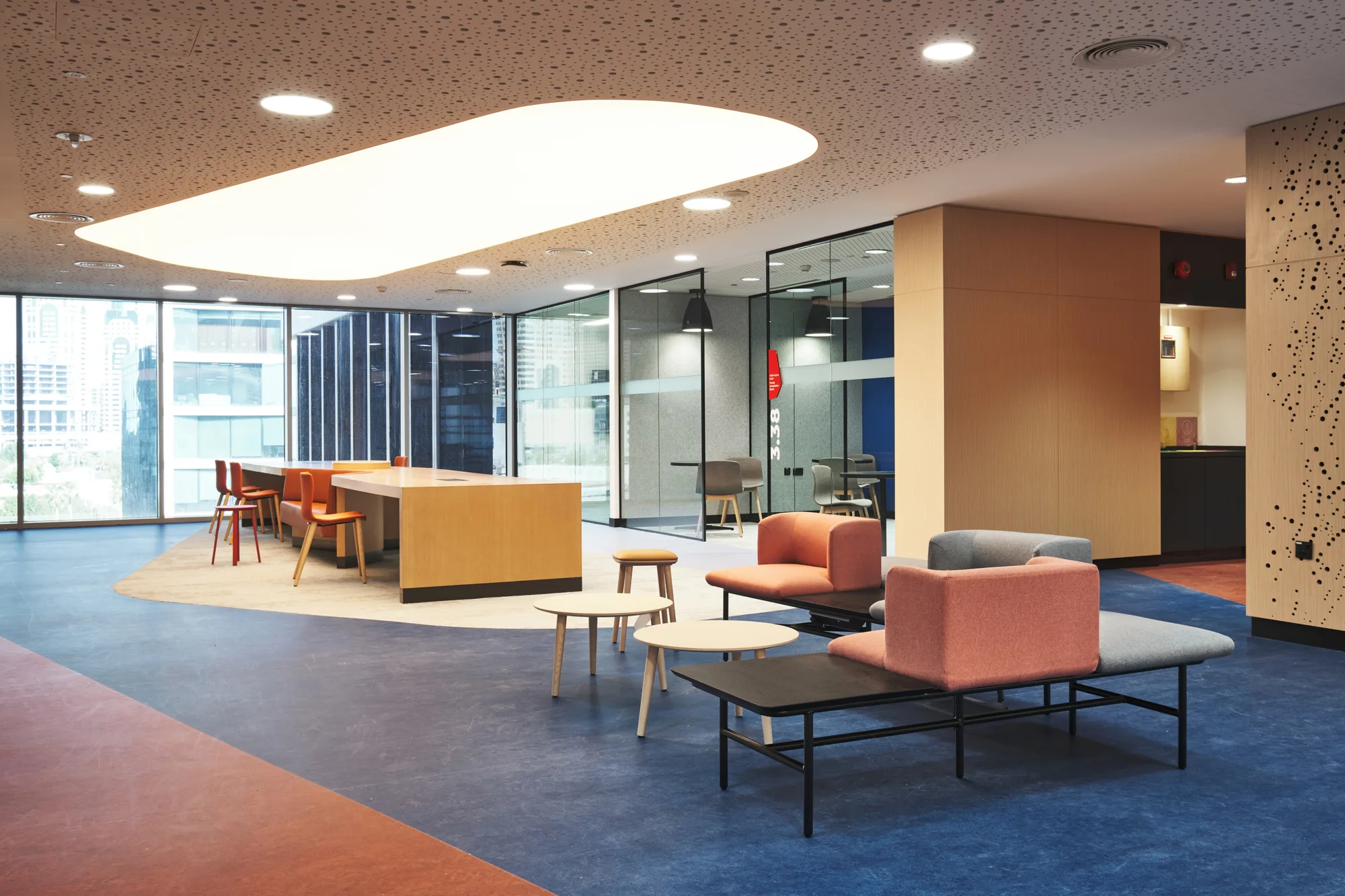 University Wollongong Dubai second floor common area with desks and chairs.