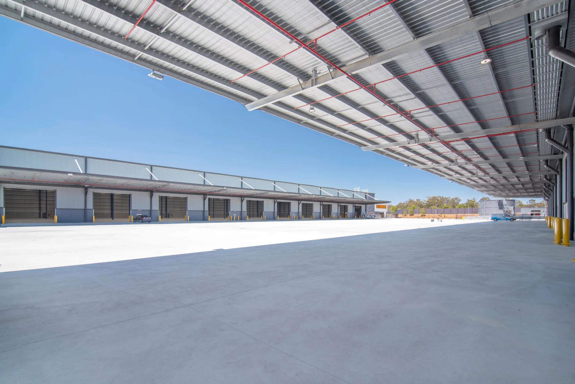 Distribution centre warehouse building with sky in background