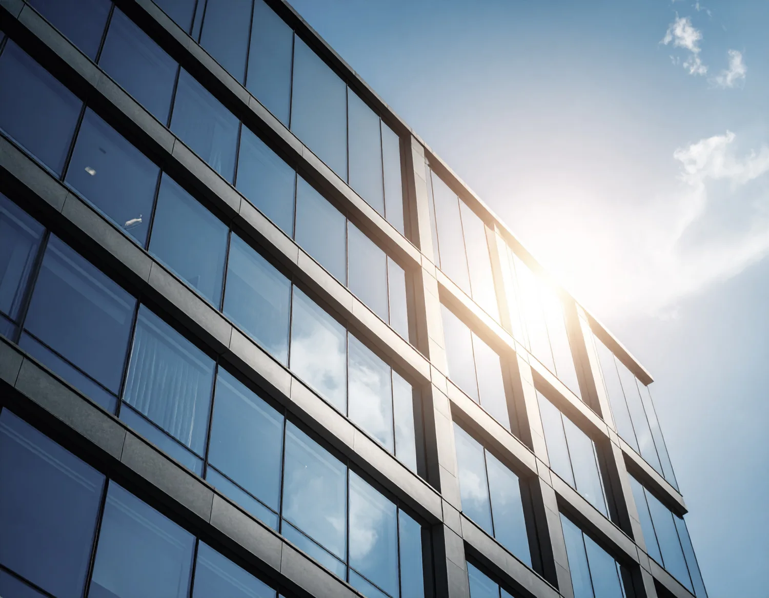 Glazed high rise office building in the afternoon sun.